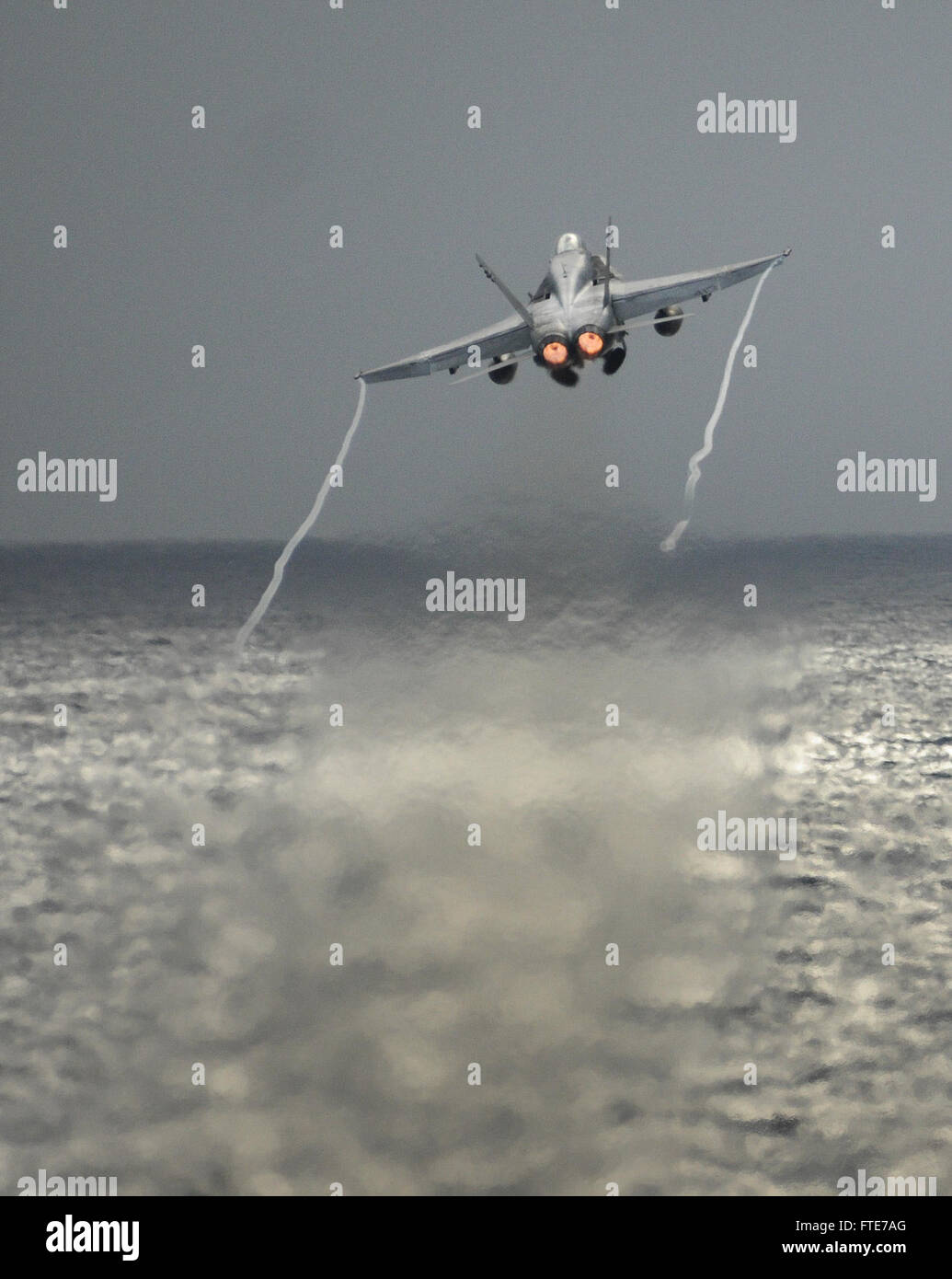 MEDITERRANEAN SEA (Nov. 5, 2013) An F/A-18F Super Hornet assigned to the “Black Knights” of Strike Fighter Squadron (VFA) 154 launches from the flight deck of the aircraft carrier USS Nimitz (CVN 68). Nimitz is deployed supporting maritime security operations and theater security cooperation efforts in the U.S. 6th Fleet area of operations. (U.S. Navy photo by Mass Communication Specialist Seaman Kole E. Carpenter/Released) Stock Photo