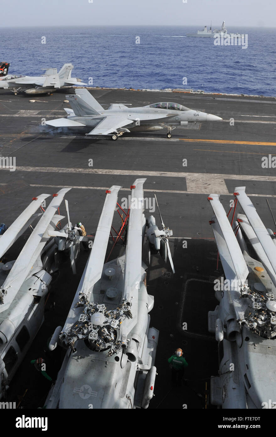 MEDITERRANEAN SEA (Nov. 7, 2013) An F/A-18F Super Hornet assigned to the “Black Knights” of Strike Fighter Squadron (VFA) 154 lands on the flight deck of the aircraft carrier USS Nimitz (CVN 68). Nimitz is deployed supporting maritime security operations and theater security cooperation efforts in the U.S. 6th Fleet area of operations. (U.S. Navy photo by Mass Communication Specialist Seaman Eric M. Butler/ Released) Stock Photo