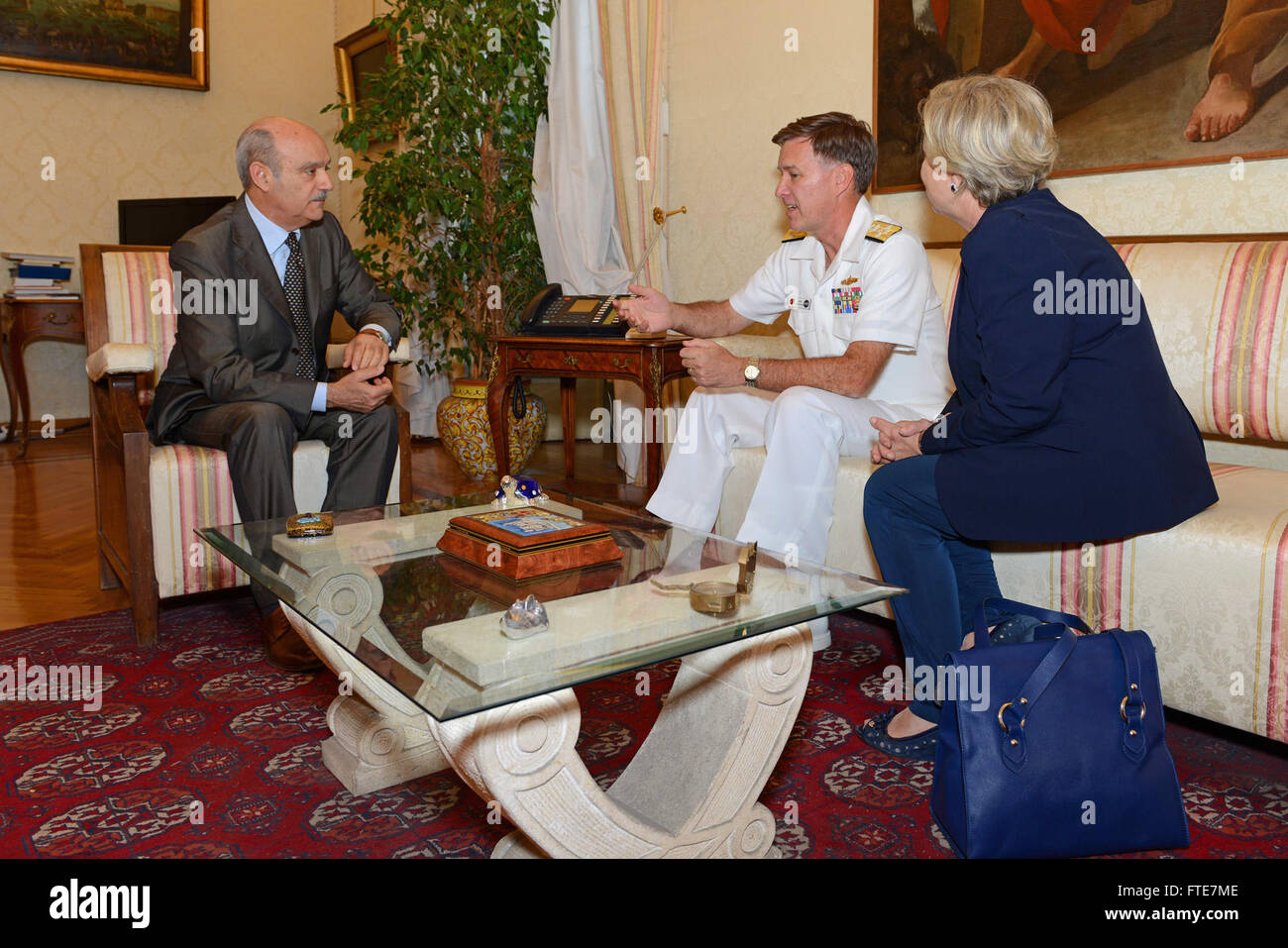 140723-N-AW206-036  NAPLES, Italy (July 23, 2014) - Commander, Allied Joint Force Command, Naples/Commander, U.S. Naval Forces Europe-Africa, Adm. Mark Ferguson, center, meets with the Prefect of Naples, Dr. H.E. Francesco Antonio Musolino, left. Ferguson expressed his appreciation to the people of Naples for their support, and reiterated his commitment to strengthening the relationship with the Naples community. (U.S. Navy photo by Mass Communication Specialist 2nd Class Jacob D. Moore/Released) Stock Photo