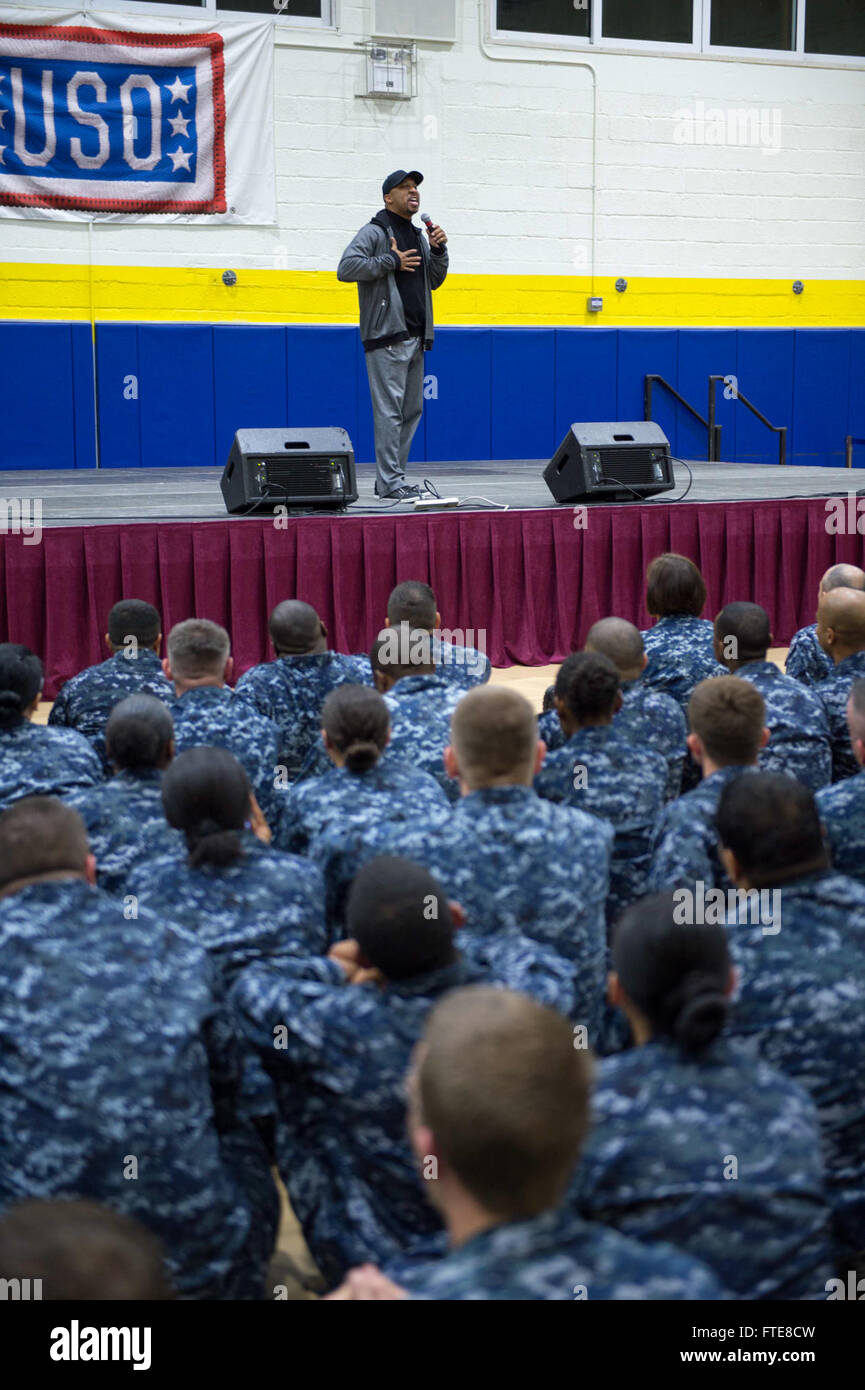 SOUDA BAY, Greece  (Dec. 08, 2013) -   Comedian Nephew Tommy entertains the crowd of Sailors, Marines, and Airman at the annual USO holiday tour at Naval Support Activity (NSA) Souda Bay.  The tour features a variety of other celebrities and the Chairman of the Joint Chiefs of Staff visiting four countries and five bases to interact with the troops for the holidays.  Stout, homeported in Norfolk, Va., is on a scheduled deployment supporting maritime security operations and theater security cooperation efforts in the U.S. 6th Fleet area of operation. (U.S. Navy photo by Mass Communication Speci Stock Photo