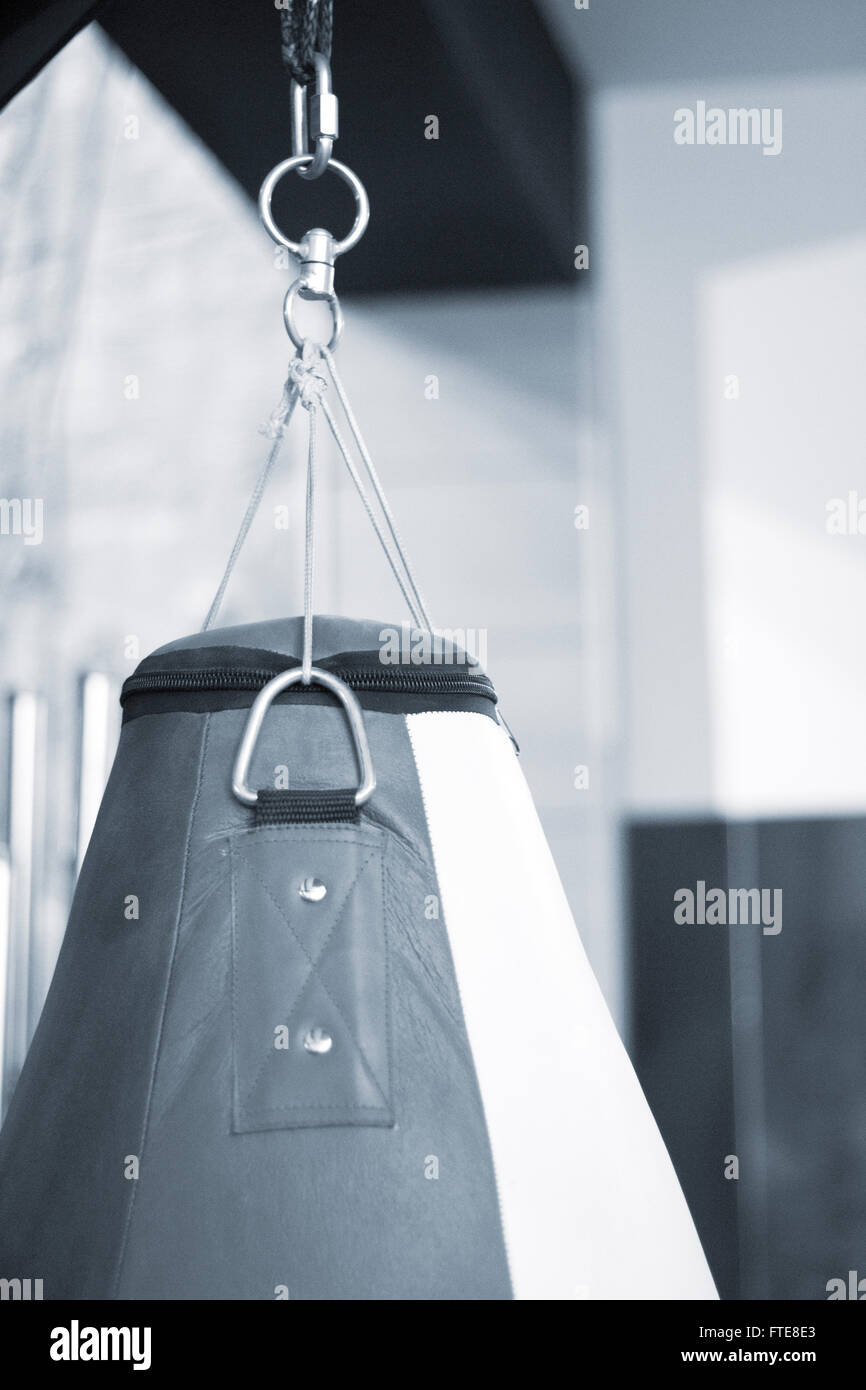 Punch, knee, elbow strike and kick punchbag in boxing, kickboxing