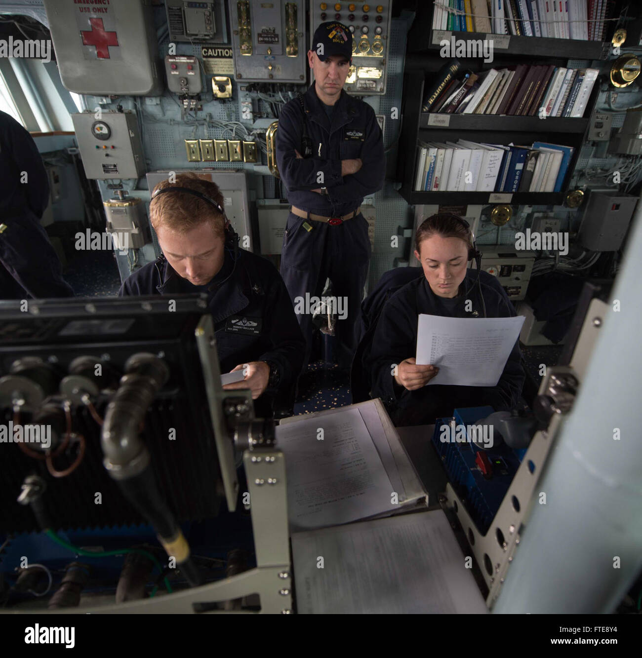 150224-N-TC720-039 MEDITERRANEAN SEA (Feb. 24, 2015) Fire Controlman 1st Class Robert Walker and Gunner's Mate 3rd Class Rachel Beglan prepare for a live-fire gunnery exercise aboard USS Cole (DDG 67) Feb. 24, 2015. Cole, an Arleigh Burke-class guided-missile destroyer, homeported in Norfolk, is conducting naval operations in the U.S. 6th Fleet area of operations in support of U.S. national security interests in Europe. (U.S. Navy photo by Mass Communication Specialist 3rd Class Mat Murch/Released) Stock Photo
