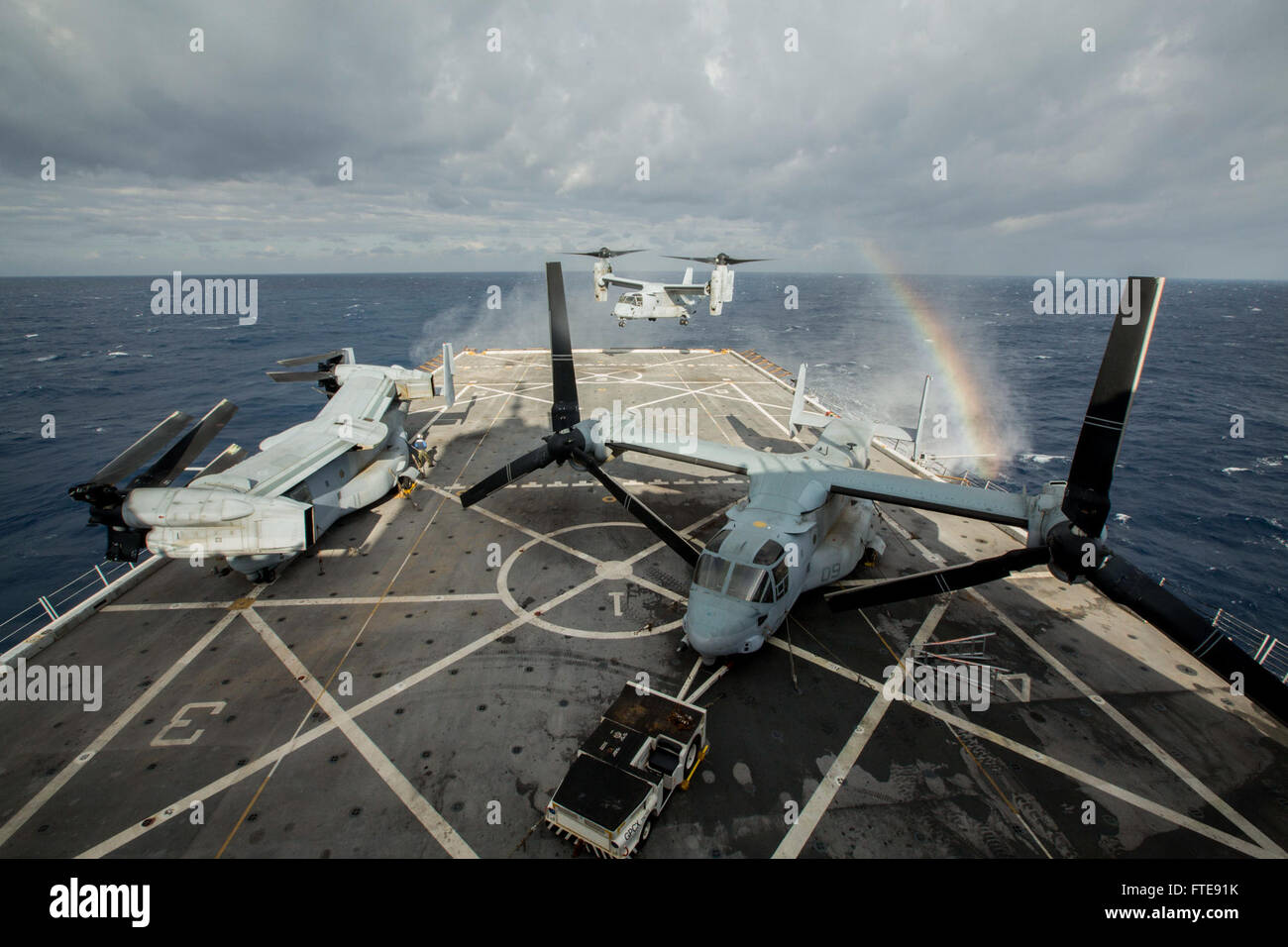 150105-M-YH418-003 MEDITERRANEAN SEA (Jan. 5, 2015) An MV-22B Osprey, assigned to Marine Medium Tiltrotor Squadron 365 (Reinforced), 24th Marine Expeditionary Unit, hovers over the flight deck of the USS New York (LPD 21), Jan. 5, 2015. The 24th MEU and Iwo Jima Amphibious Ready Group are conducting naval operations in the U.S. 6th Fleet area of operations in support of U.S. national security interests in Europe. (U.S. Marine Corps photo by Cpl. Todd F. Michalek/Released) Stock Photo