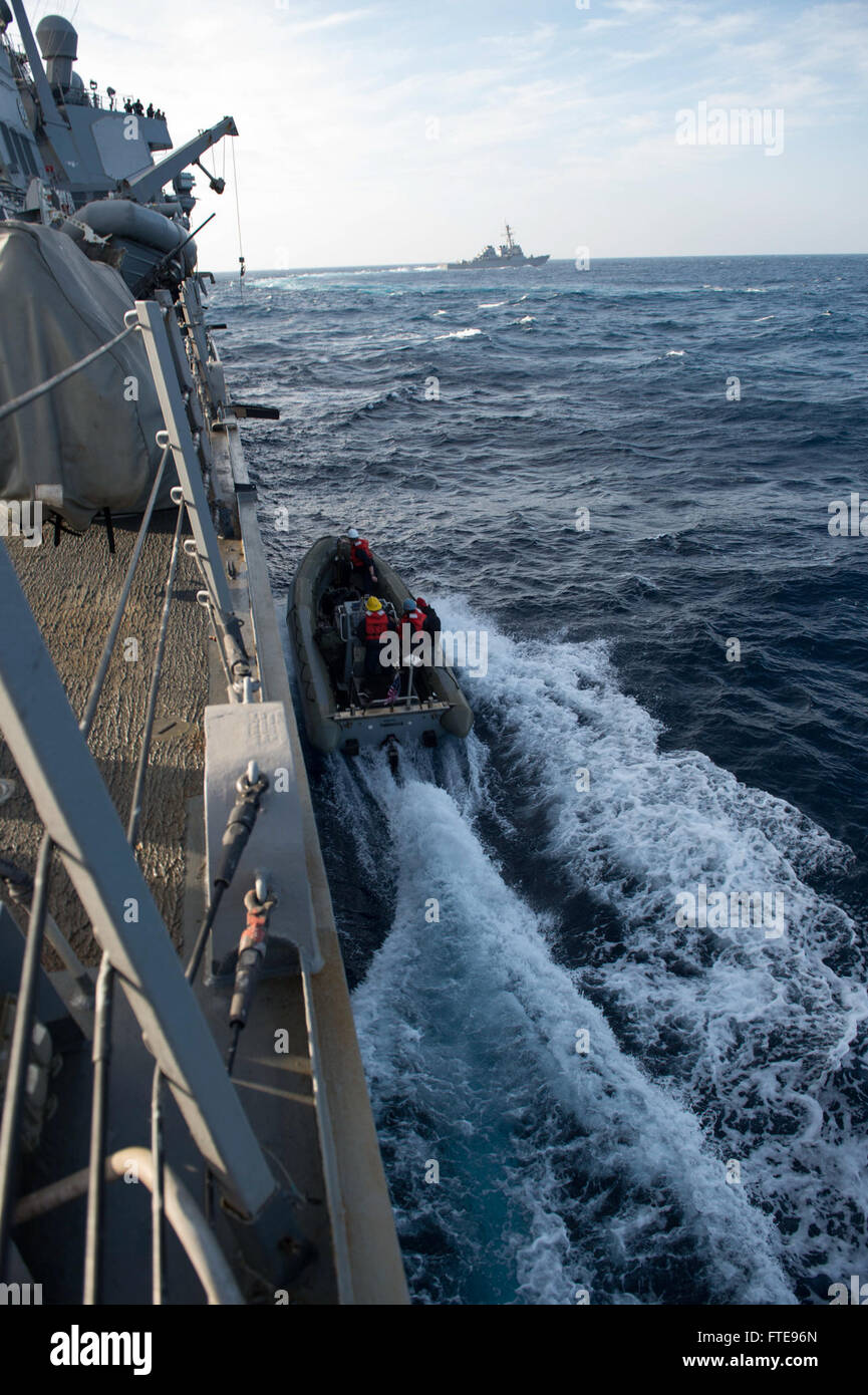 U.S. Navy sailors aboard the Arleigh Burke-class destroyers USS Stout ...
