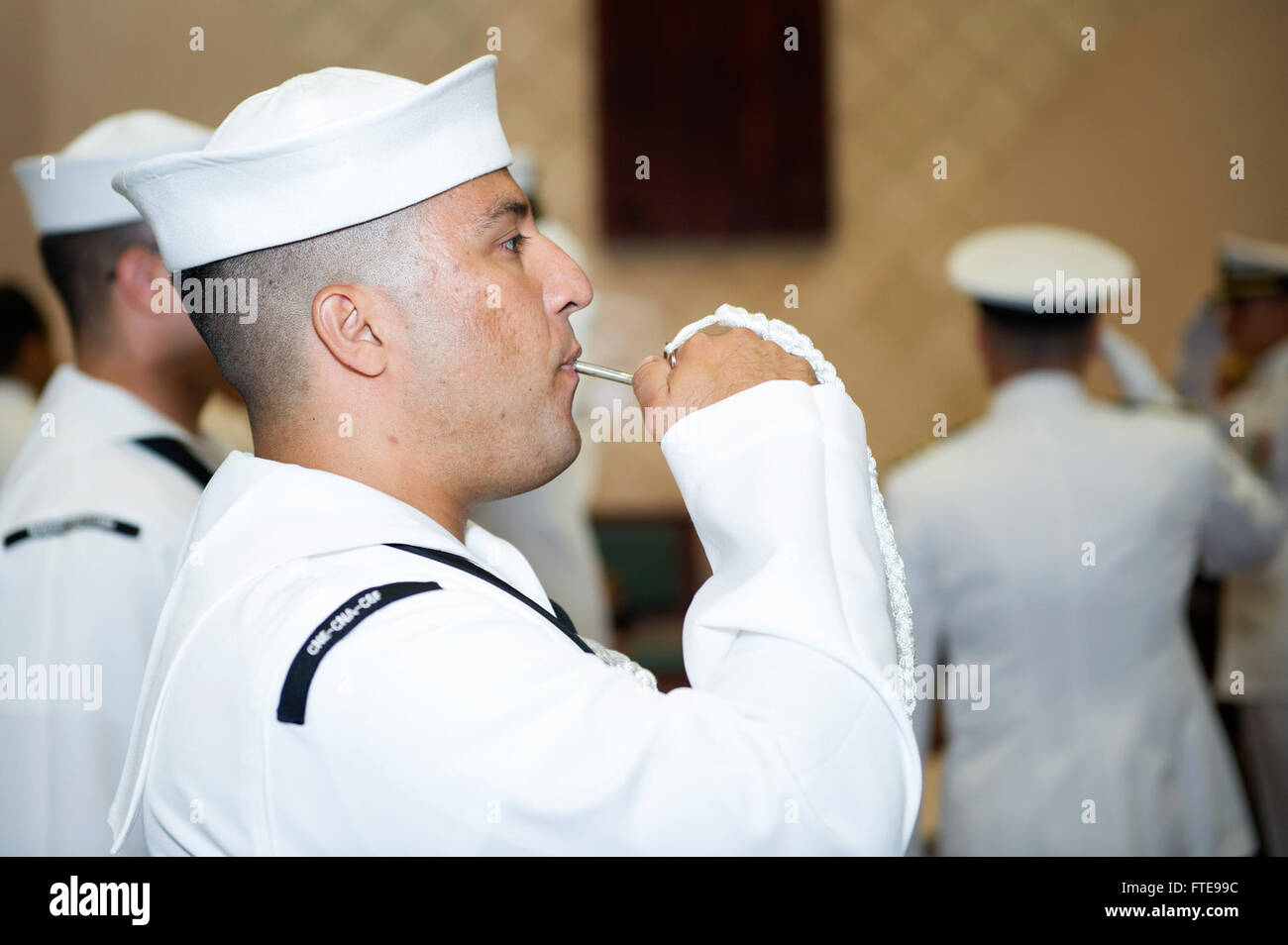 150717-N-YQ852-010 NAPLES, Italy (July 17, 2015) Yeoman 1st Class Alfredo Barros, from Cartagena, Colombia, pipes aboard a distinguished guest during a change of command ceremony for Commander, Task Force 69, Capt. Marc Stern at Naval Support Activity Naples, Italy, July 17, 2015. Capt. Marc Stern turned over command to Capt. Anthony Carullo. . U.S. 6th Fleet, headquartered in Naples, Italy, conducts the full spectrum of joint and naval operations, often in concert with allied, joint, and interagency partners, in order to advance U.S. national interests and security and stability in Europe and Stock Photo
