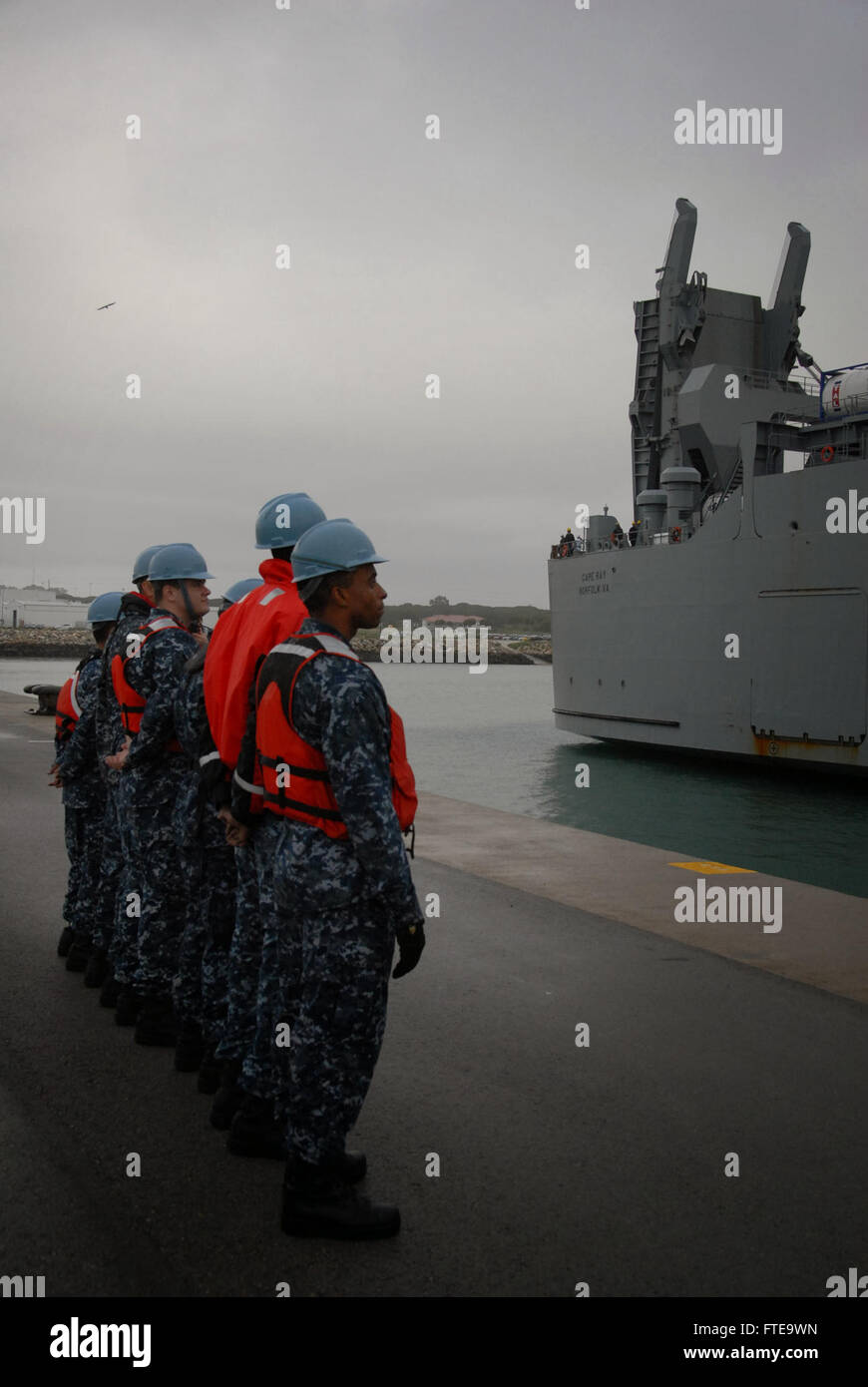 140213-N-UI568-338: ROTA, Spain (Feb. 13, 2014) – Sailors assigned to Naval Station Rota await the arrival of the container ship MV Cape Ray (T-AKR 9679) for a scheduled port visit. The vessel was modified to contribute to the United Nations and the Organization for the Prohibition of Chemical Weapons joint mission to eliminate Syria's chemical weapons materials. (U.S. Navy photo by Morgan Over/Released) Join the conversation on Twitter ( https://twitter.com/naveur navaf )  follow us on Facebook ( https://www.facebook.com/USNavalForcesEuropeAfrica )  and while you're at it check us out on Goog Stock Photo
