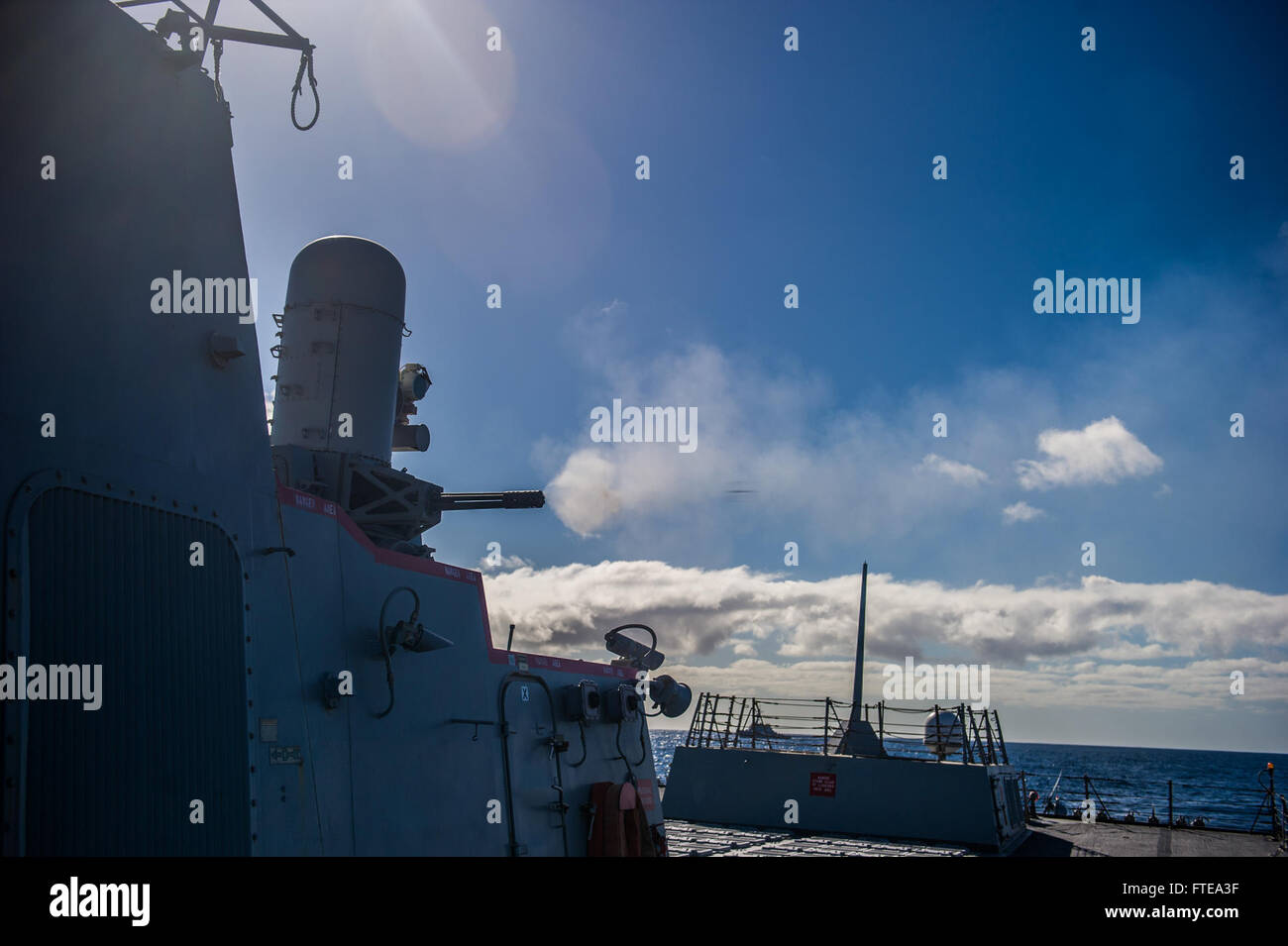 140219-N-EI510-113 ATLANTIC OCEAN (Feb. 19, 2014)  The Arleigh Burke-class guided-missile destroyer USS Truxtun (DDG 103) fires its Phalanx Close-In Weapons System (CWIS). Truxtun is deployed as part of the George H. W. Bush Carrier Strike Group in support of maritime security operations, theater security cooperation efforts and missions in support of Operation Enduring Freedom in the U.S. 5th and 6th Fleet areas of responsibility. (U.S. Navy photo by Mass Communication Specialist 3rd Class Scott Barnes/Released). Stock Photo