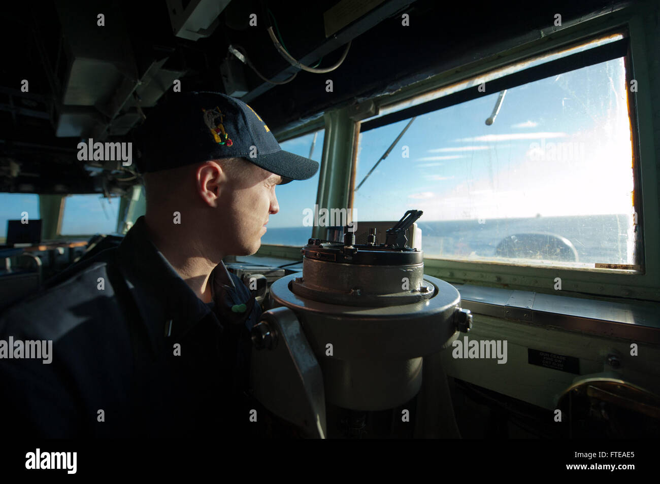140227-N-WD757-055: MEDITERRANEAN SEA (Feb. 27, 2014) – Lt.j.g. Benjamin Pitzel monitors ship direction and distance as the guided-missile destroyer USS Arleigh Burke (DDG 51) transits through the Strait of Gibraltar en route to the Mediterranean Sea. Arleigh Burke is on a scheduled deployment in support of maritime security operations and theater security cooperation efforts in the U.S. 5th and 6th Fleet area of operations. (U.S. Navy photo by Mass Communication Specialist 2nd Class Carlos M. Vazquez II/Released) Stock Photo