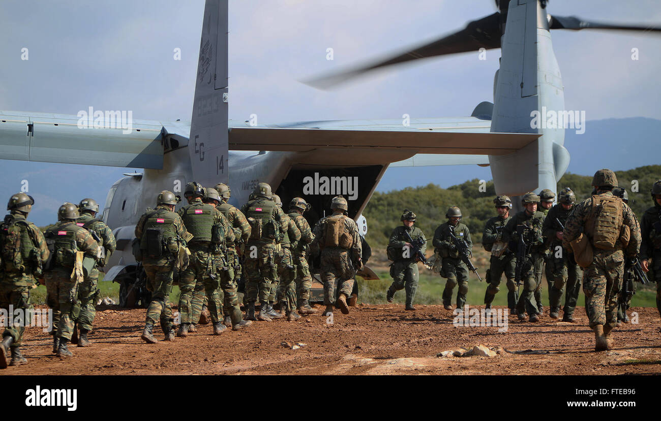 140308-M-WB921-116 GREECE (March 8, 2014) - U.S. Marines with Battalion Landing Team 1st Battalion, 6th Marine Regiment, 22nd Marine Expeditionary Unit (MEU), and members of the Hellenic Army board and exit an MV-22 Osprey aircraft during a bilateral training exercise. The U.S. and Greece regularly conduct scheduled military exercises to strengthen professional and personal relationships. The MEU is deployed to the U.S. 6th Fleet area of operations with the Bataan Amphibious Ready Group as a sea-based, expeditionary crisis response force capable of conducting amphibious missions across the ful Stock Photo