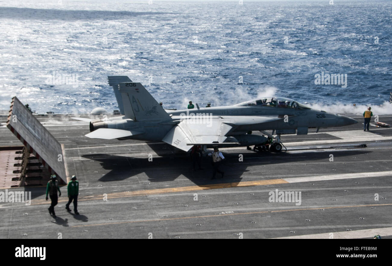 140308-N-SI489-216 MEDITERRANEAN Sea (Mar. 8, 2014) An F/A-18F Super Hornet attached to the “Fighting Black Lions” of Strike Fighter Squadron (VFA) 213 prepares to launch on the flight deck of the aircraft carrier USS George H.W. Bush (CVN 77). George H. W. Bush is on a scheduled deployment supporting maritime security operations and theater security cooperation efforts in the U.S. 6th Fleet area of operations.  (U.S. Navy photo by Mass Communication Specialist Seaman Andrew Johnson/Released) Stock Photo