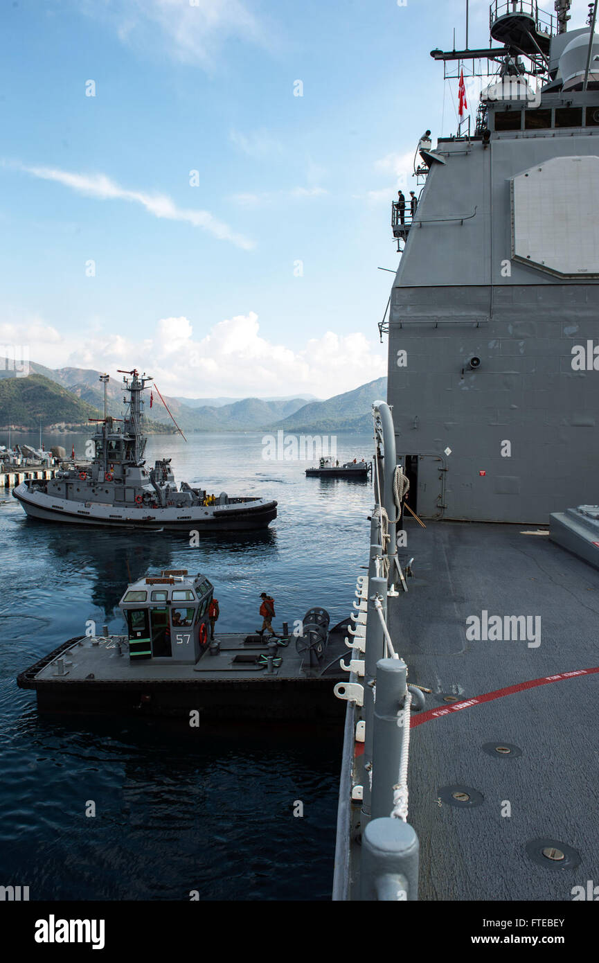 1400309-N-PJ969-138 AKSAZ, Turkey (March 09, 2014) Turkish tug boats assist the guided-missile cruiser USS Philippine Sea (CG 58) while it moors in Aksaz, Turkey. Philippine Sea is on a scheduled deployment supporting maritime security operations and theater security cooperation efforts in the U.S. 6th fleet area of responsibility. (U.S. Navy photo by Mass Communication Specialist 3rd Class Abe McNatt/Released) Stock Photo