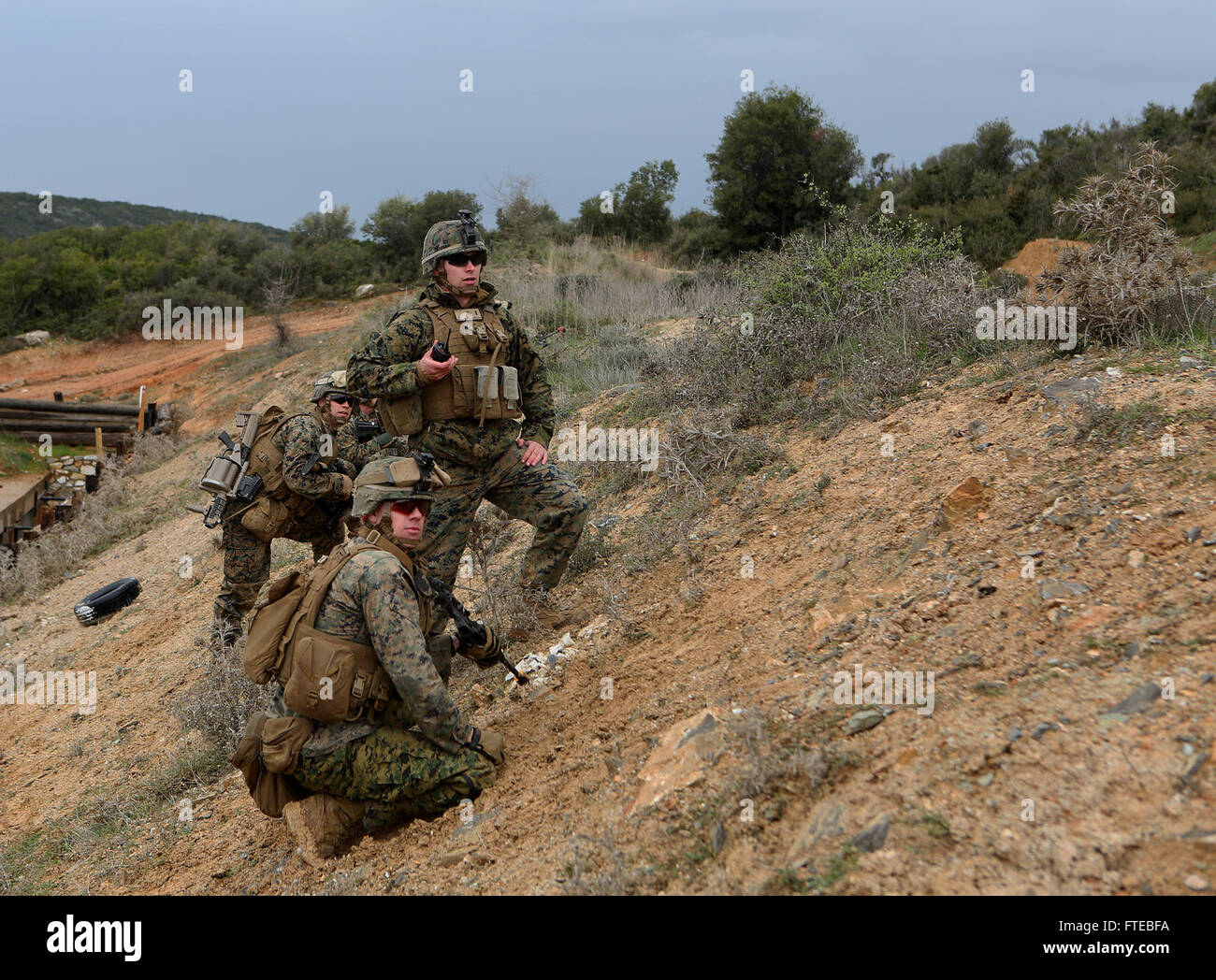 140309-M-WB921-486 GREECE (March 9, 2014) - U.S. Marines with Battalion Landing Team 1st Battalion, 6th Marine Regiment, 22nd Marine Expeditionary Unit (MEU), assault a hill during a bilateral training exercise with the Hellenic Army. The U.S. and Greece regularly conduct scheduled military exercises to strengthen professional and personal relationships. The MEU is deployed to the U.S. 6th Fleet area of operations with the Bataan Amphibious Ready Group as a sea-based, expeditionary crisis response force capable of conducting amphibious missions across the full range of military operations. (U. Stock Photo
