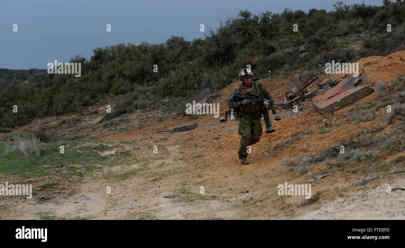 140309-M-WB921-497 GREECE (March 9, 2014) - A U.S. Marine with Battalion Landing Team 1st Battalion, 6th Marine Regiment, 22nd Marine Expeditionary Unit (MEU), assaults a hill during a bilateral training exercise with the Hellenic Army. The U.S. and Greece regularly conduct scheduled military exercises to strengthen professional and personal relationships. The MEU is deployed to the U.S. 6th Fleet area of operations with the Bataan Amphibious Ready Group as a sea-based, expeditionary crisis response force capable of conducting amphibious missions across the full range of military operations. ( Stock Photo