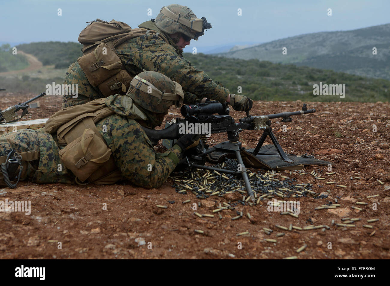 140310-M-WB921-602 GREECE (March 10, 2014) - U.S. Marines with Battalion Landing Team 1st Battalion, 6th Marine Regiment, 22nd Marine Expeditionary Unit (MEU), provide suppressing fire during a bilateral training exercise with the Hellenic Army. The U.S. and Greece regularly conduct scheduled military exercises to strengthen professional and personal relationships. The MEU is deployed to the U.S. 6th Fleet area of operations with the Bataan Amphibious Ready Group as a sea-based, expeditionary crisis response force capable of conducting amphibious missions across the full range of military oper Stock Photo