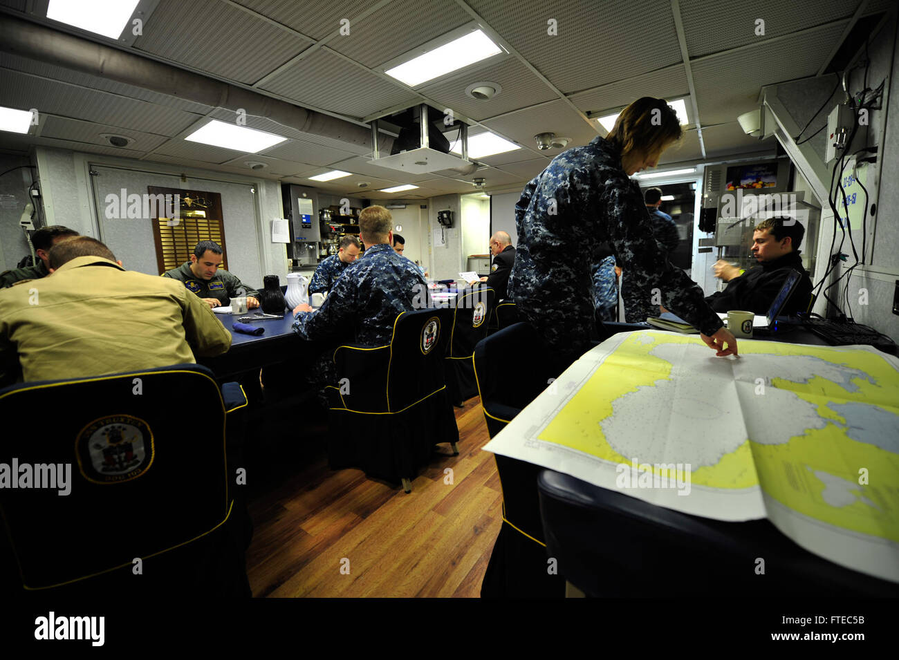 140315-N-AL577-004 VARNA, Bulgaria (March 15, 2014) Sailors from the U.S., Bulgarian, and Romanian navies plan for a future Black Sea training exercise (BSTE) in the wardroom aboard the guided missile destroyer USS Truxtun (DDG 103). Truxtun is deployed as part of the George H. W. Bush Strike Group on a scheduled deployment supporting maritime security operations and theater security cooperation efforts in the U.S. 6th fleet area of operations. (U.S. Navy photo by Lt. Shawn P. Eklund/Released) Stock Photo