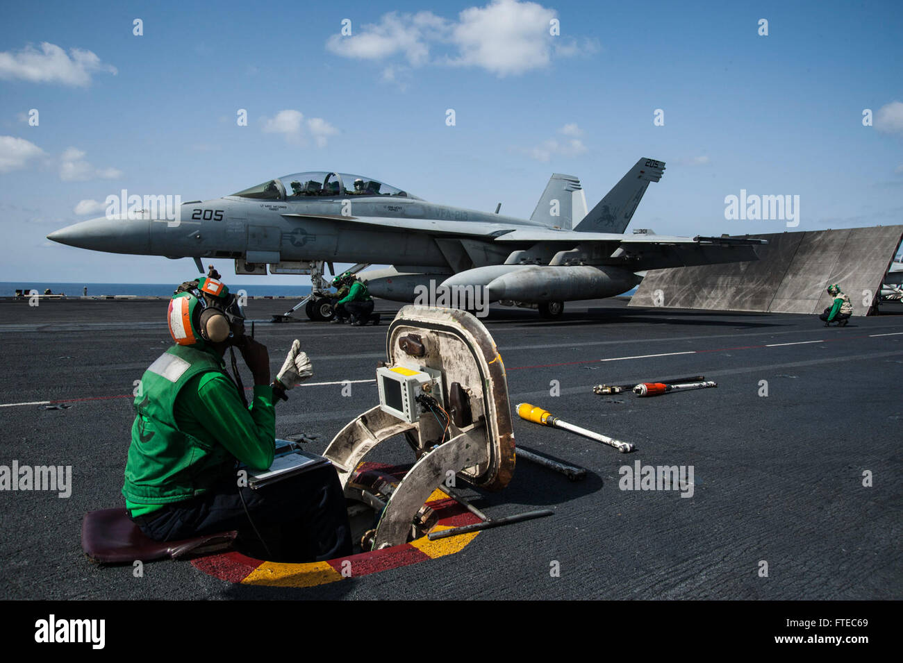 On March 15, 2014, sailors aboard the USS George H.W. Bush (CVN 77) prepare to launch an F/A-18F Super Hornet from the ‘Fighting Black Lions’ of VFA-213. The aircraft carrier was deployed to the Mediterranean Sea to support maritime security and theater cooperation within the U.S. 6th Fleet's area of operations. Stock Photo