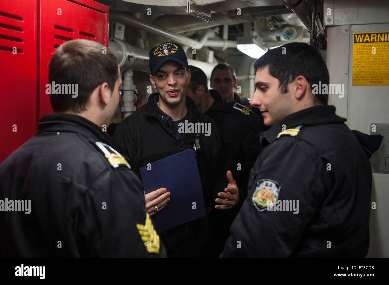 BLACK SEA (March 19, 2014) - Lt. j.g. Joseph Testa, of Phlugerville, Texas, gives Bulgarian Naval Academy cadets a tour of the Arleigh Burke-class guided-missile destroyer USS Truxtun (DDG 103). The Truxtun is deployed as part of the George H. W. Bush Strike Group on a scheduled deployment supporting maritime security operations and theater security cooperation efforts in the U.S. 6th Fleet area of operations. (U.S. Navy photo by Mass Communication Specialist 3rd Class Scott Barnes/Released) Stock Photo
