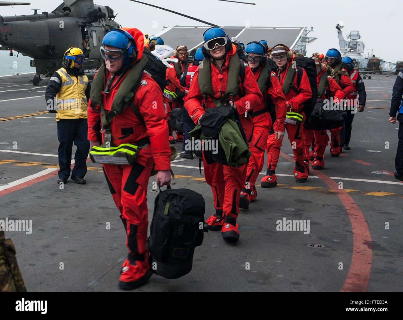 140403-N-WX580-058 NORTH SEA (Apr. 3, 2014) Royal Marines prepare to disembark the Royal Navy aircraft carrier HMS Illustrious (R06) during exercise Joint Warrior 14-1.  Joint Warrior 14-1 is a semi-annual, United Kingdom led training exercise designed to provide NATO and allied forces a unique multi-warfare environment in which to prepare for global operations. The Joint Warrior exercise is intended to improve interoperability between allied navies in an operational challenging environment. (U.S. Navy photo by Mass Communication Specialist 3rd Class Lacordrick Wilson/Released) Stock Photo