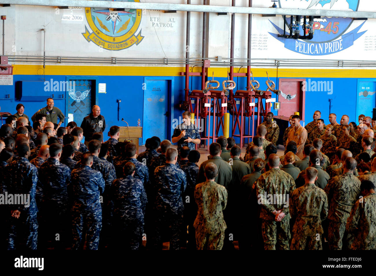 SIGONELLA, Sicily (April 17, 2014) - Vice Adm. Phil Davidson, commander, U.S. 6th Fleet, addresses personnel from Patrol Squadron (VP) 9 during an all-hands call at Naval Air Station Sigonella. VP-9 is forward deployed to the U.S. 6th Fleet area of responsibility and is assigned to CTF 67, responsible for tactical control of deployed maritime patrol and reconnaissance squadrons throughout the European and African areas of responsibility. (U.S. Navy photo by Mass Communication Specialist Seaman Amber Porter/Released) Stock Photo