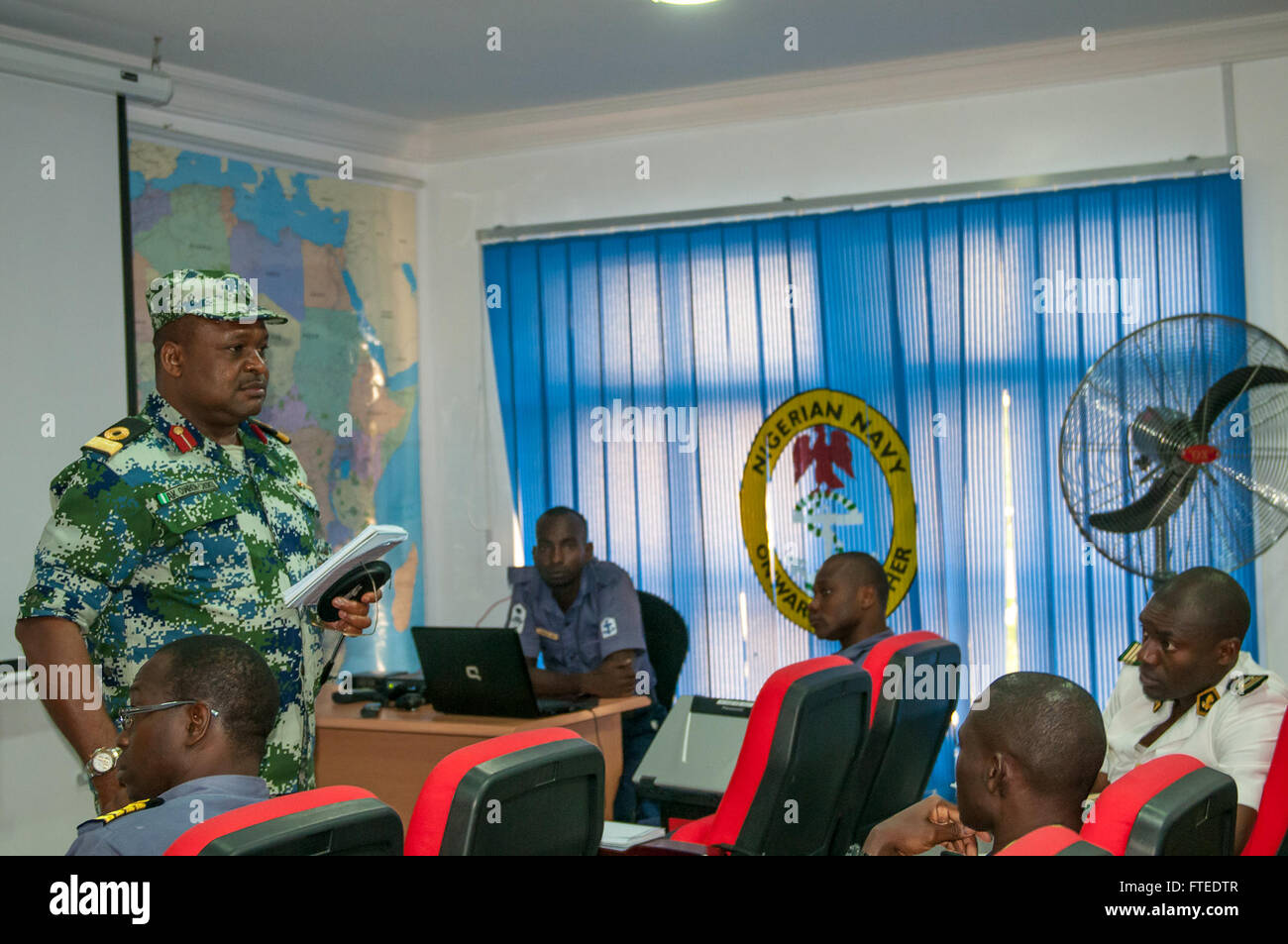 140420-N-ZE250-017 LAGOS, Nigeria (April 20, 2014) - Nigerian navy Commodore AK Owhor-chuku, national multi-force commander of Obangame Express 2014, briefs African military personnel about the upcoming events at the exercise headquarters, Nigerian Western Naval Command. Obangame Express is a U.S. Africa Command-sponsored multinational maritime exercise designed to increase maritime safety and security in the Gulf of Guinea.  (U.S. Navy Photo by Mass Communication Specialist Weston Jones/Released)  Join the conversation on <a href='https://twitter.com/naveur navaf' rel='nofollow'>Twitter</a> f Stock Photo