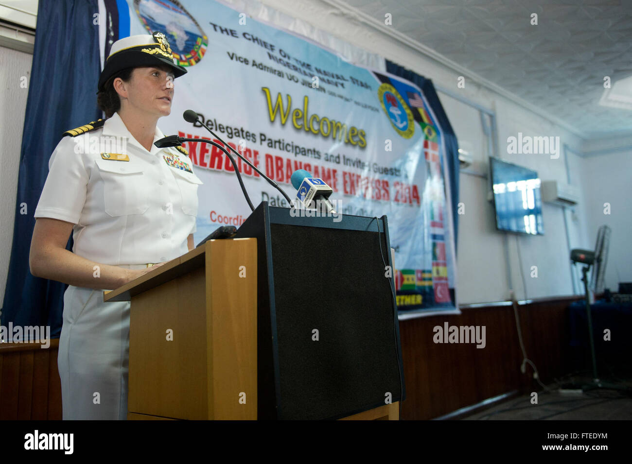 140423-N-IY142-121 LAGOS, Nigeria (April 23, 2014) - U.S. Navy Capt. Nancy Lacore, exercise director for Obangame Express 2014, gives her closing remarks during the exercise closing ceremony at the Nigerian navy’s Western Naval Command headquarters. Obangame Express is a U.S. Africa Command-sponsored multinational maritime exercise designed to increase maritime safety and security in the Gulf of Guinea. (U.S. Navy photo by Mass Communication Specialist 2nd Class John Herman/Released) Stock Photo