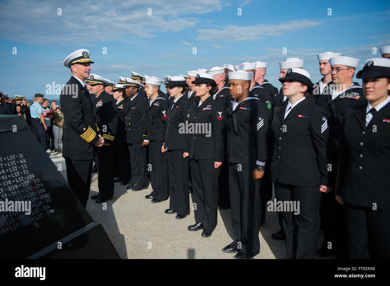 140605-N-YO152-146 UTAH BEACH, France (June 5, 2014) - Chief of Naval Operations, Adm. Jonathan Greenert, addresses Sailors assigned to the guided-missile destroyer USS Oscar Austin (DDG 79) prior to a D-Day ceremony at the Navy Memorial on Utah Beach. The event was one of several commemorations of the 70th Anniversary of D-Day operations conducted by Allied forces World War II June 5-6, 1944. Over 650 U.S. military personnel have joined troops from several NATO nations to participate in ceremonies to honor the events at the invitation of the French government. (U.S. Navy photo by Mass Communi Stock Photo