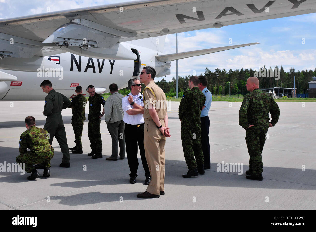 140609-N-MV308-559: ÄMARI AIR BASE, Estonia (June 9, 2014) - Cdr. Ron Rios,  Defense Attache, U.S. Embassy, Tallinn, Estonia, speaks with Estonian  sailors including Capt. Sten Sepper, Commander of the Estonian Navy, during