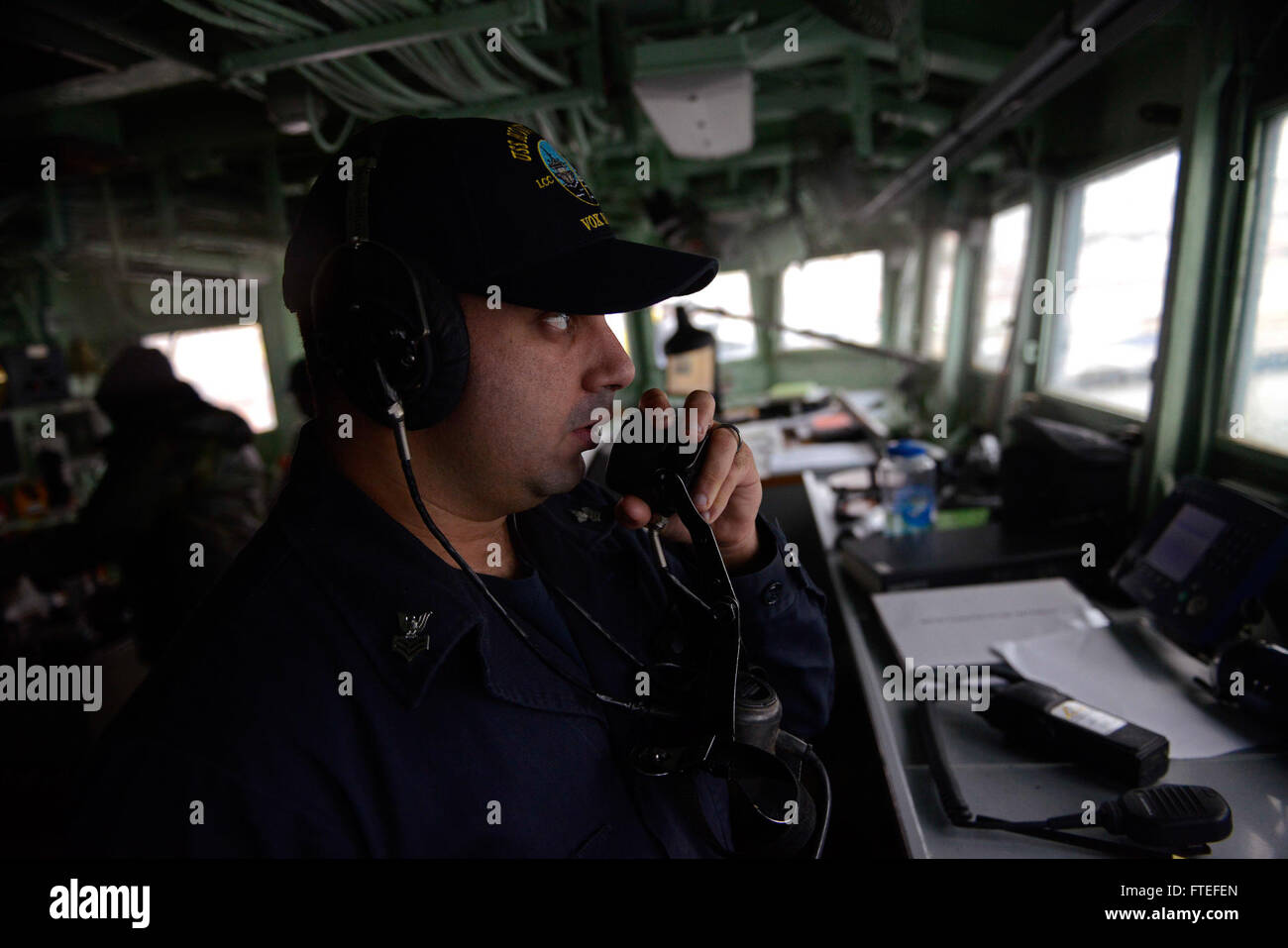 151101-N-VY489-005 LISBON, Portugal (Nov. 01, 2015) Operations Specialist 1st Class Gabriel Torres relays information on the bridge, as the U.S. 6th Fleet command and control ship USS Mount Whitney (LCC 20) prepares to enter port in Lisbon, Portugal, Nov. 01,  2015. Mount Whitney, forward deployed to Gaeta, Italy, operates with a combined crew of Sailors and Military Sealift Command civil service mariners. (U.S. Navy photo by Mass Communication Specialist 1st Class Mike Wright/ Released) Stock Photo