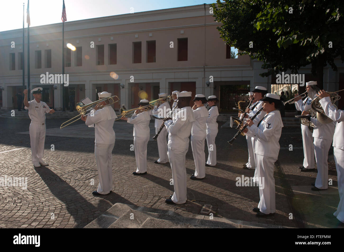 The U.S. Naval Forces Europe Ceremonial Band performs morning colors at