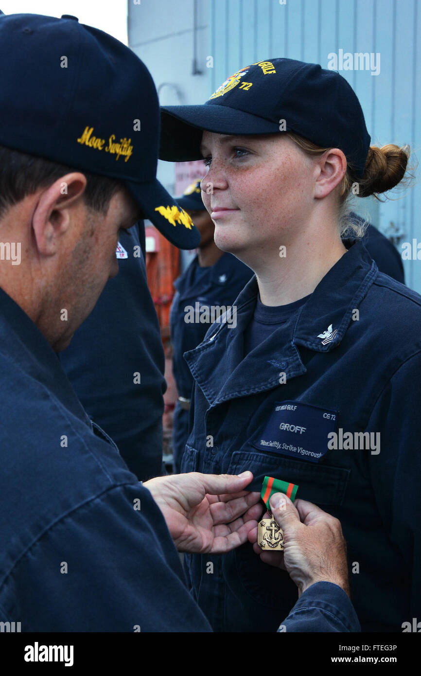 Logistics Specialist 1st Class Alisha Groff receives the Naval