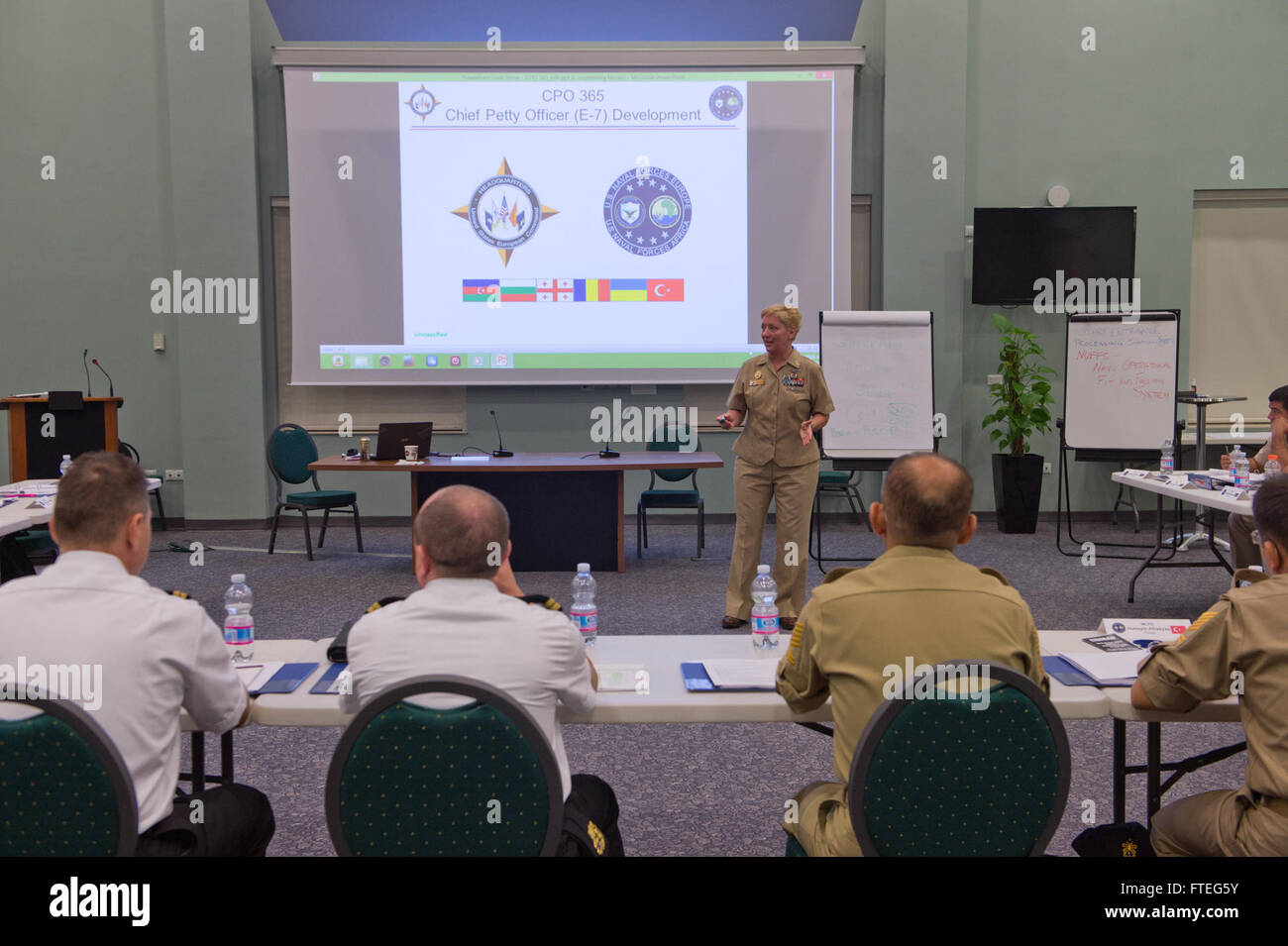 140909-N-TC720-013 NAPLES, Italy (Sept. 9, 2014) Fleet Master Chief JoAnn M. Ortloff, of U.S. Naval Forces Europe-Africa, speaks to noncommissioned officers during the Eurasia Partnership (EP) Non-Commissioned Officer (NCO) Development Familiarization workshop on Naval Support Activity (NSA) Naples, Sept. 9. EP Non-Commissioned Officer (NCO) Development is a military to military, multi-lateral international cooperation engagement that familiarizes partner nation maritime NCOs with US Navy CPO 365. (U.S. Navy photo by Mass Communication Specialist Seaman Mat Murch/ Released) Stock Photo