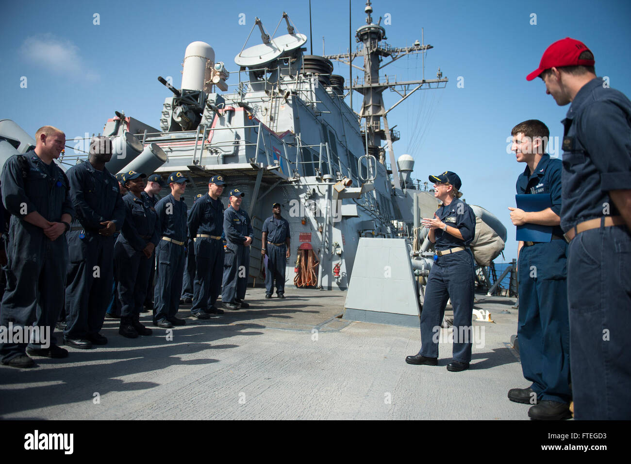 140926-N-WD757-315 MEDITERRANEAN SEA (Sept. 26, 2014) Cmdr. Camille Flaherty, commanding officer of the guided-missile destroyer USS Arleigh Burke (DDG 51), speaks to Sailors during a presentation ceremony. Arleigh Burke, homeported in Norfolk, Va., is conducting naval operations in the U.S. 6th Fleet area of operations in support of U.S. national security interests in Europe. (U.S. Navy photo by Mass Communication Specialist 2nd Class Carlos M. Vazquez II/Released) Stock Photo