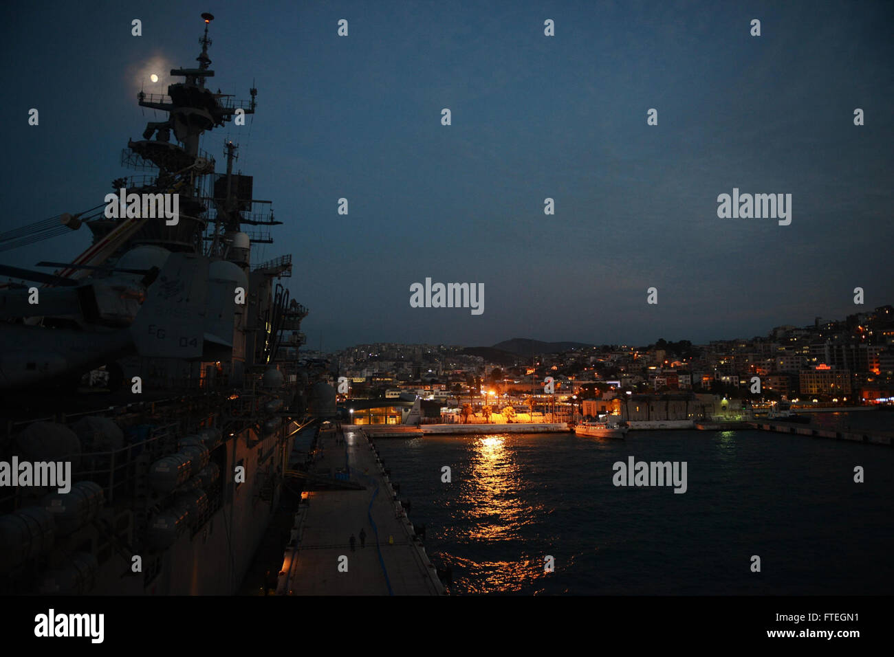 KUSADASI, Turkey (Oct. 5, 2014) The amphibious assault ship USS Bataan (LHD 5) sits pier side during a port call in Kusadasi, Turkey. The Bataan Amphibious Ready Group is on a scheduled deployment supporting maritime security operations, providing crisis response capability and theater security cooperation efforts in the U.S. 6th Fleet area of operations. Stock Photo
