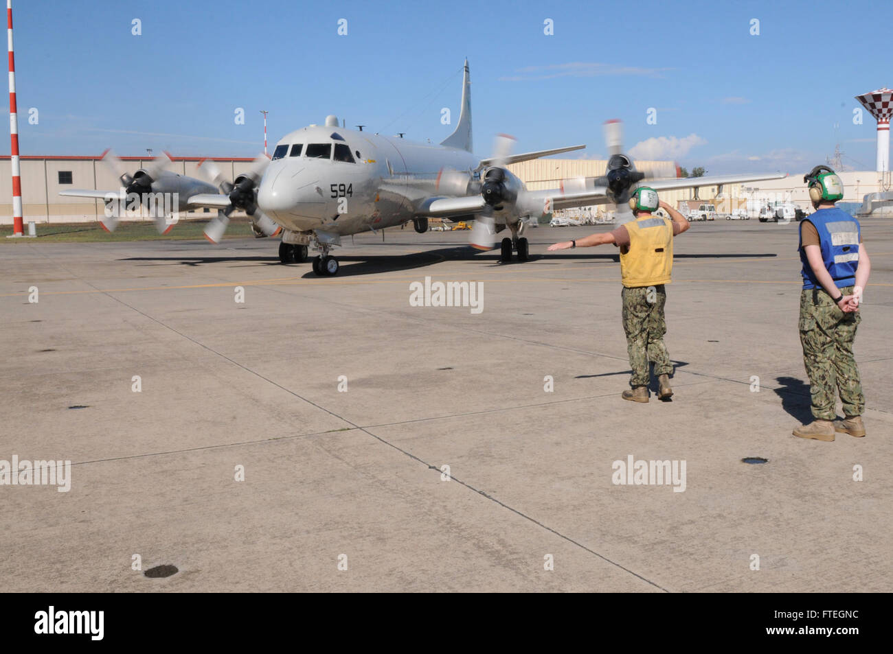 SIGONELLA, Sicily (Oct. 6, 2014) - Aviation Machinists Mate 3rd Class Jason Conyers launches a P-3C Orion maritime patrol aircraft attached to Patrol Squadron FOUR (VP-4). VP-4 is conducting naval operations in the U.S. 6th Fleet area of operations in support of U.S. national security and interests in Europe. Stock Photo
