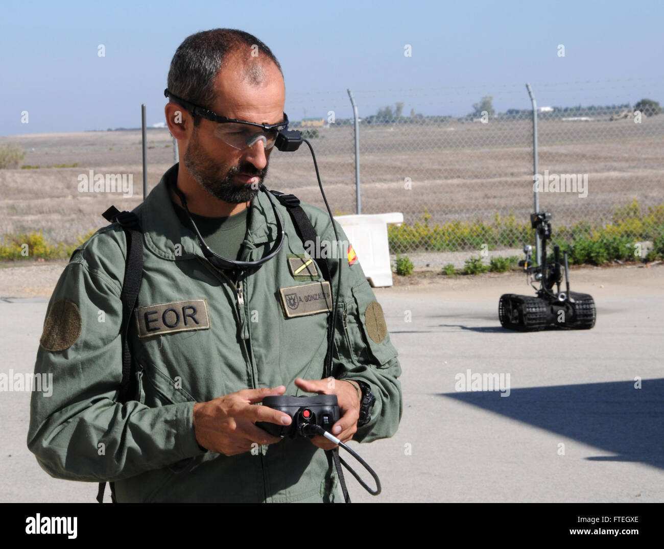 NAVAL STATION ROTA, Spain (Oct. 7, 2014) – Spanish Marine Cabo Mayor Antonio Gonzalez Ruiz operates a small unmanned ground vehicle (SUGV) robot as part of the 2014 Cadizex Exercise at the simulated urban terrain compound Hogan's Alley aboard Naval Station Rota.  Spanish Marines Brimar from San Fernando, Spain, U.S. Navy Sailors, and Italian navy 1st Regiment San Marco from Venice, Italy worked in tandem during the trilateral exercise meant to strengthen bonds between NATO allies and provide strategic training. Stock Photo