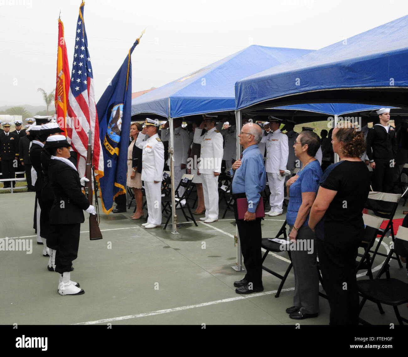 NAVAL STATION ROTA, Spain (October 17, 2014) – U.S. Navy and Spanish navy color guard members present arms during USS Donald Cook (DDG 75) change of command ceremony, Oct. 17. Donald Cook is the first of four Arleigh Burke-class destroyers to be forward-deployed to Rota, Spain, as part of the President's European Phased Adaptive Approach (EPAA) to ballistic missile defense in Europe. Stock Photo