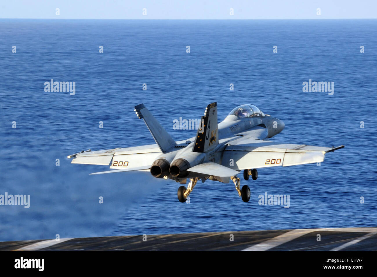MEDITERRANEAN SEA (Oct. 29, 2014) An F/A-18F Super Hornet, attached to the “Fighting Black Lions” of Strike Fighter Squadron (VFA) 213, launches from the flight deck of the aircraft carrier USS George H.W. Bush (CVN 77). George H.W. Bush, homeported in Norfolk, Va., is conducting naval operations in the U.S. 6th Fleet area of operations in support of U.S. national security interests in Europe. Stock Photo