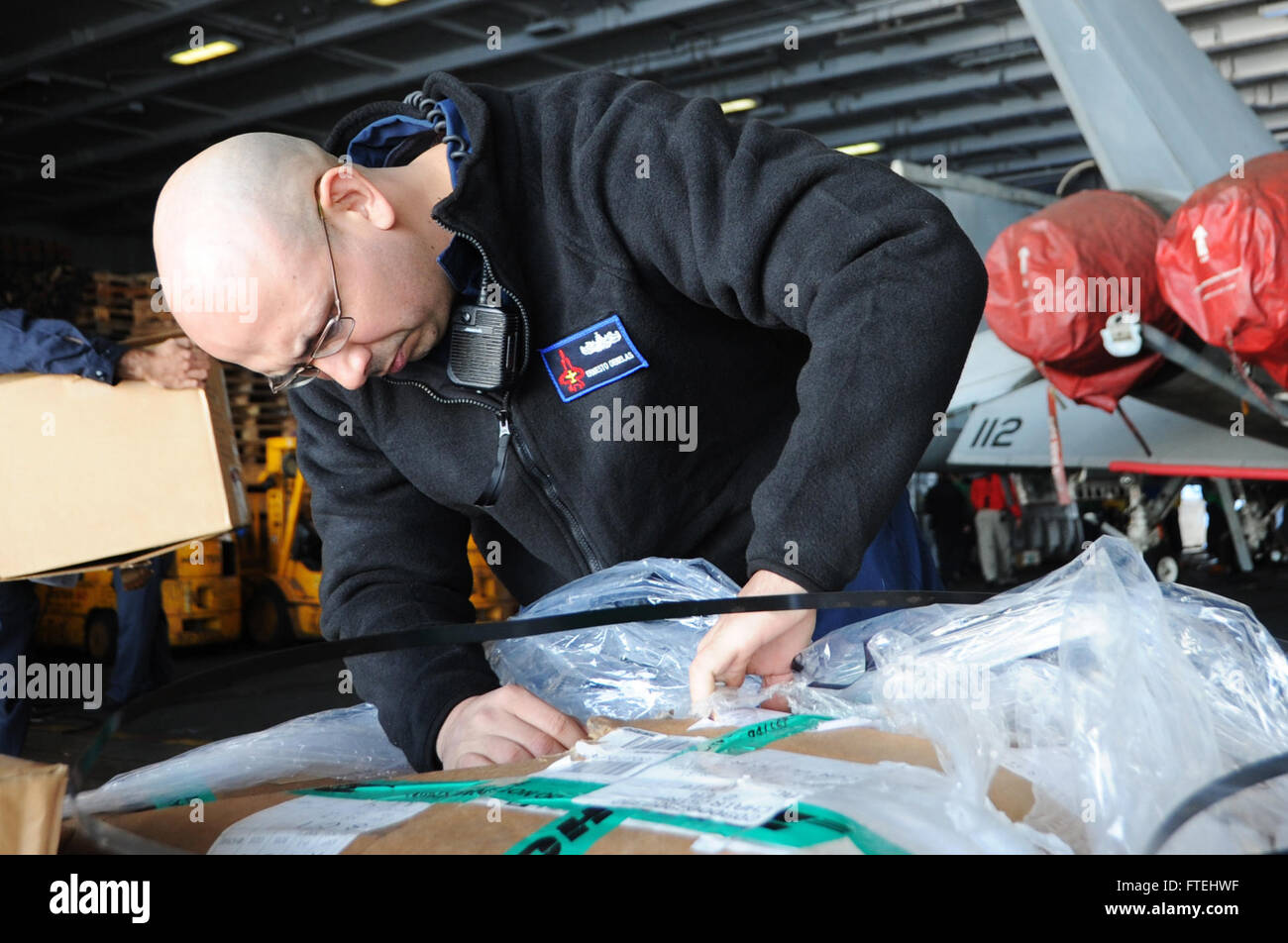 MEDITERRANEAN SEA (Oct. 29, 2014) Culinary Specialist 1st Class Ernesto Ornelas, from El Paso, Texas, logs supplies aboard the aircraft carrier USS George H.W. Bush (CVN 77). George H.W. Bush, homeported in Norfolk, Va., is conducting naval operations in the U.S. 6th Fleet area of operations in support of U.S. national security interests in Europe. Stock Photo