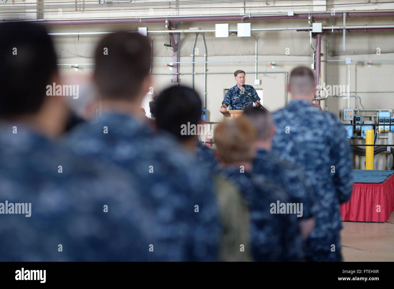 SIGONELLA, Sicily (Oct. 29, 2014) Adm. Mark Ferguson, commander of U.S. Naval Forces Europe-Africa, speaks to Sailors, Marines and Airmen during an all-hands call aboard Naval Air Station (NAS) Sigonella, Oct. 29.  Ferguson thanked Sailors for their contributions to the NATO and U.S. Naval Forces Europe-Africa mission. Stock Photo