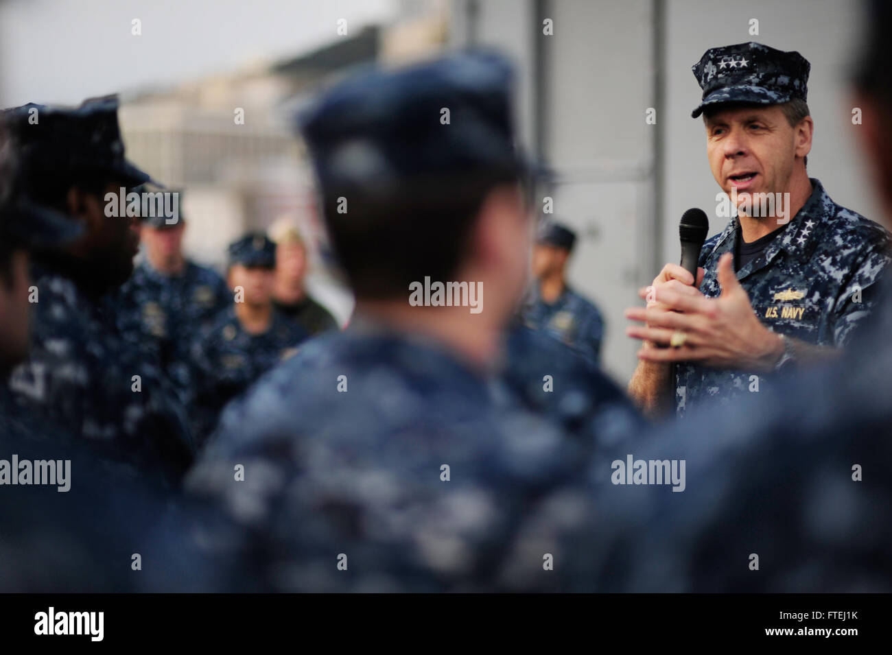 NAPLES, Italy (Jan. 24, 2014) Vice Adm. Phil Davidson, commander, U.S. 6th Fleet, addresses the crew of the Oliver Hazard Perry-class frigate USS Taylor (FFG 50) during an all-hands call. During the visit, Davidson also toured the ship and met with the ship's senior leadership. Stock Photo