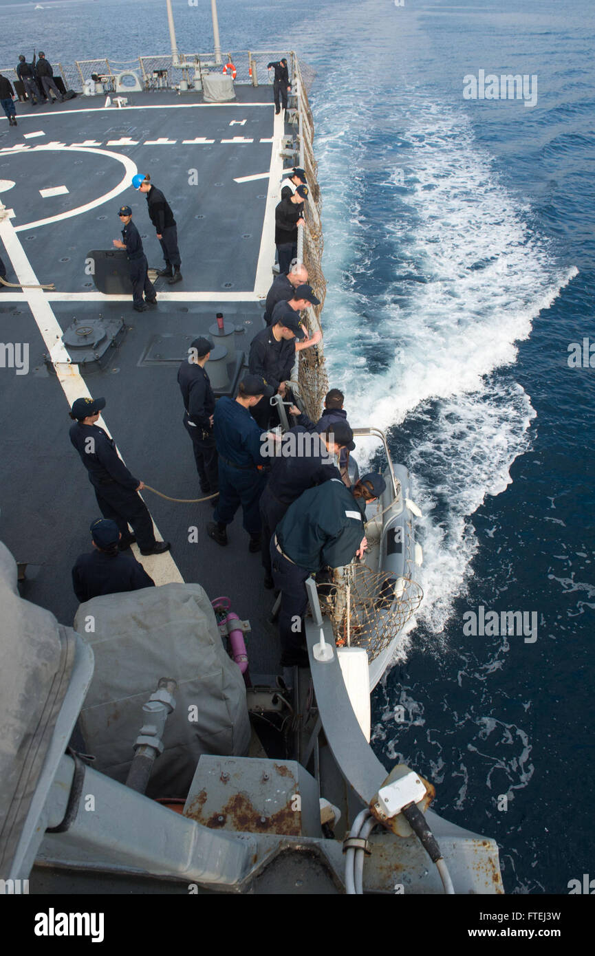 Sailors aboard USS Ross (DDG 71), an Arleigh Burke-class guided-missile ...