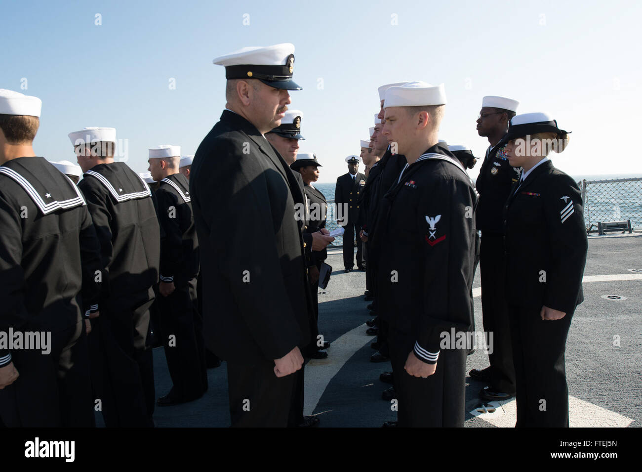BLACK SEA (Nov. 6, 2014) - Sailors aboard the USS Ross (DDG 71) conduct a dress blue uniform inspection. Ross is an Arleigh Burke-class guided-missile destroyer, homeported in Rota, Spain, conducting naval operations in the U.S. 6th Fleet area of operations in support of U.S. national security interest in Europe Stock Photo