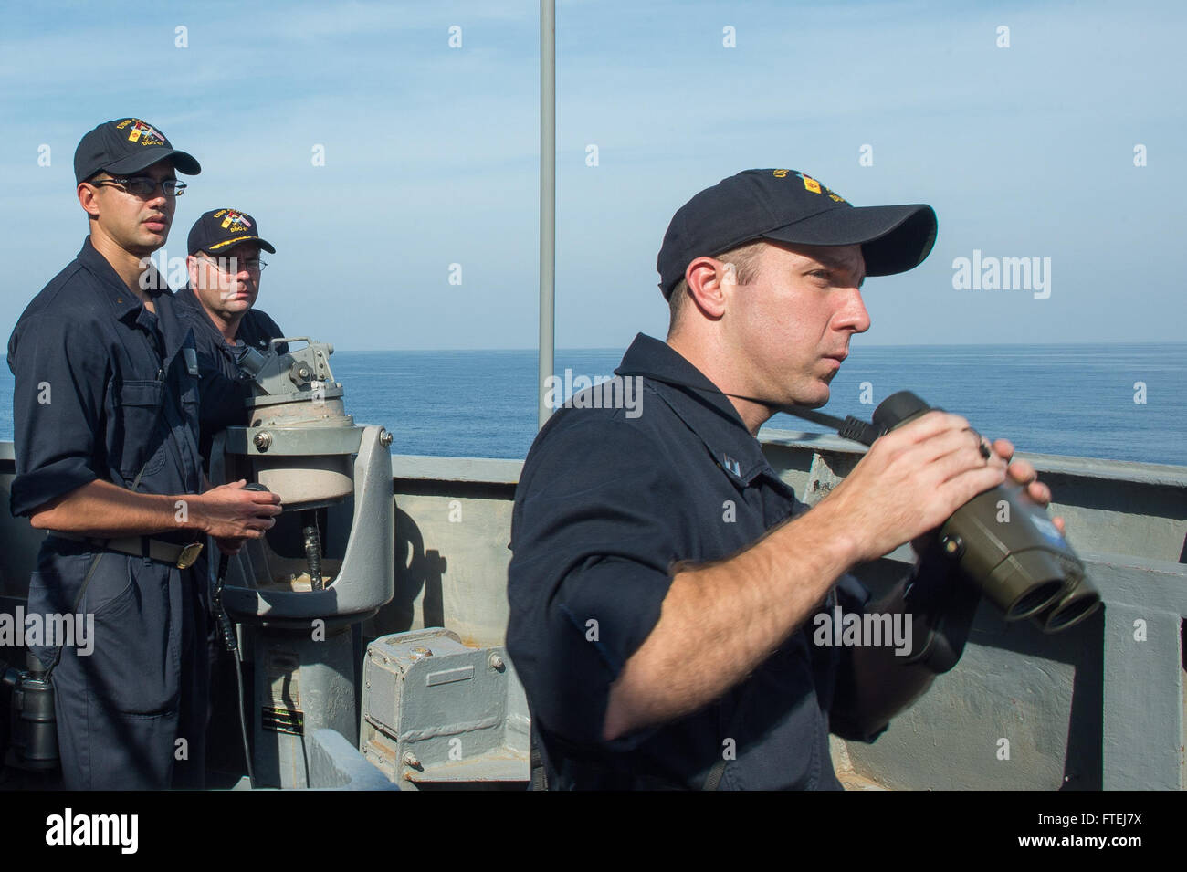 MEDITERRANEAN SEA (November 11, 2014) – Lt. Douglas Kroh, from Deltona, verifies the range of a nearby vessel aboard the Arliegh Burke-class guided-missile destroyer USS Cole (DDG 67) during exercise Mavi Balina 2014. Exercise Mavi Balina is a biennial Turkish-led anti-submarine warfare maritime exercise involving NATO and regional forces in the eastern Mediterranean to improve interoperability and increase tactical proficiencies. Stock Photo