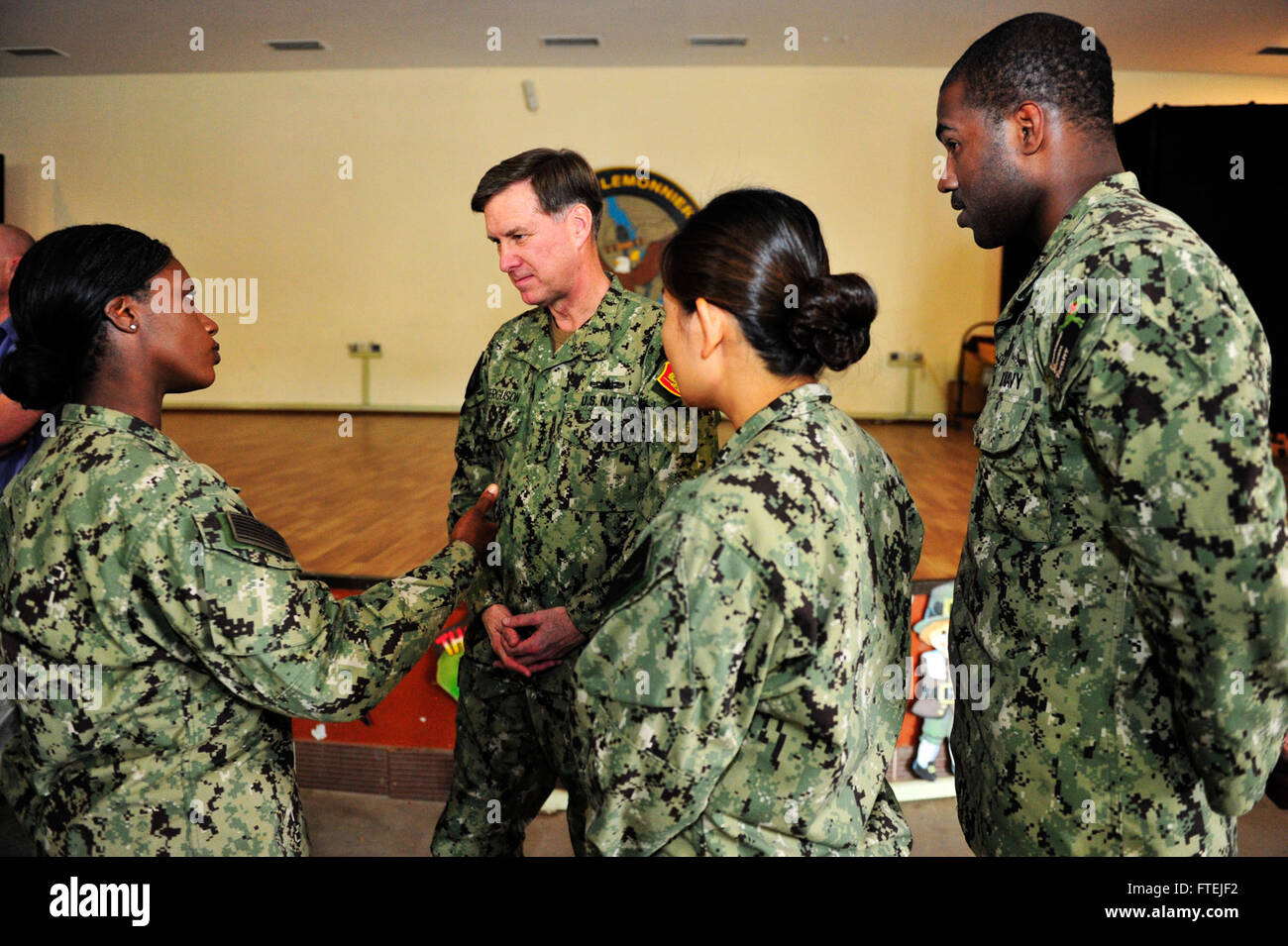 CAMP LEMONNIER, Djibouti (Nov. 27, 2014) Adm. Mark Ferguson, commander, U.S. Naval Forces Europe-Africa (center) speaks to Sailors after an All Hands Call at Camp Lemonnier. Ferguson visited Camp Lemonnier to thank Sailors for supporting forward U.S. forces and for strengthening security in East Africa. Stock Photo