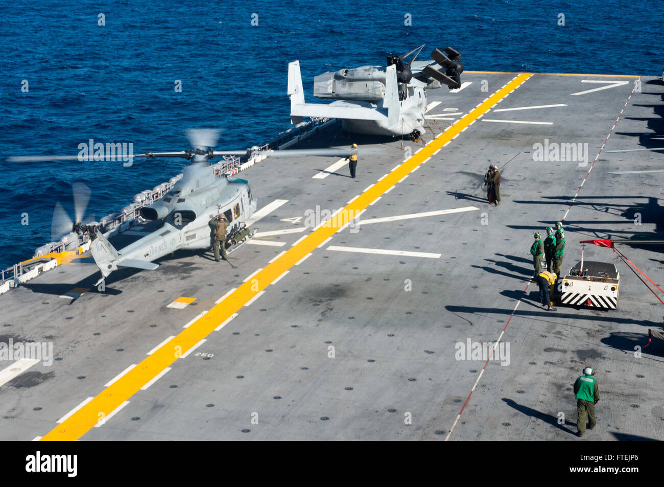 ATLANTIC OCEAN (Dec. 23, 2014) A UH-1N Huey from Marine Medium Tiltrotor Squadron 365 (Reinforced) prepares for flight operations on the flight deck of USS Iwo Jima (LHD 7) Dec. 23, 2014. The Iwo Jima Amphibious Ready Group/24th Marine Expeditionary Unit is conducting naval operations in the U.S. 6th Fleet area of operations in support of U.S. national security interests in Europe. Stock Photo