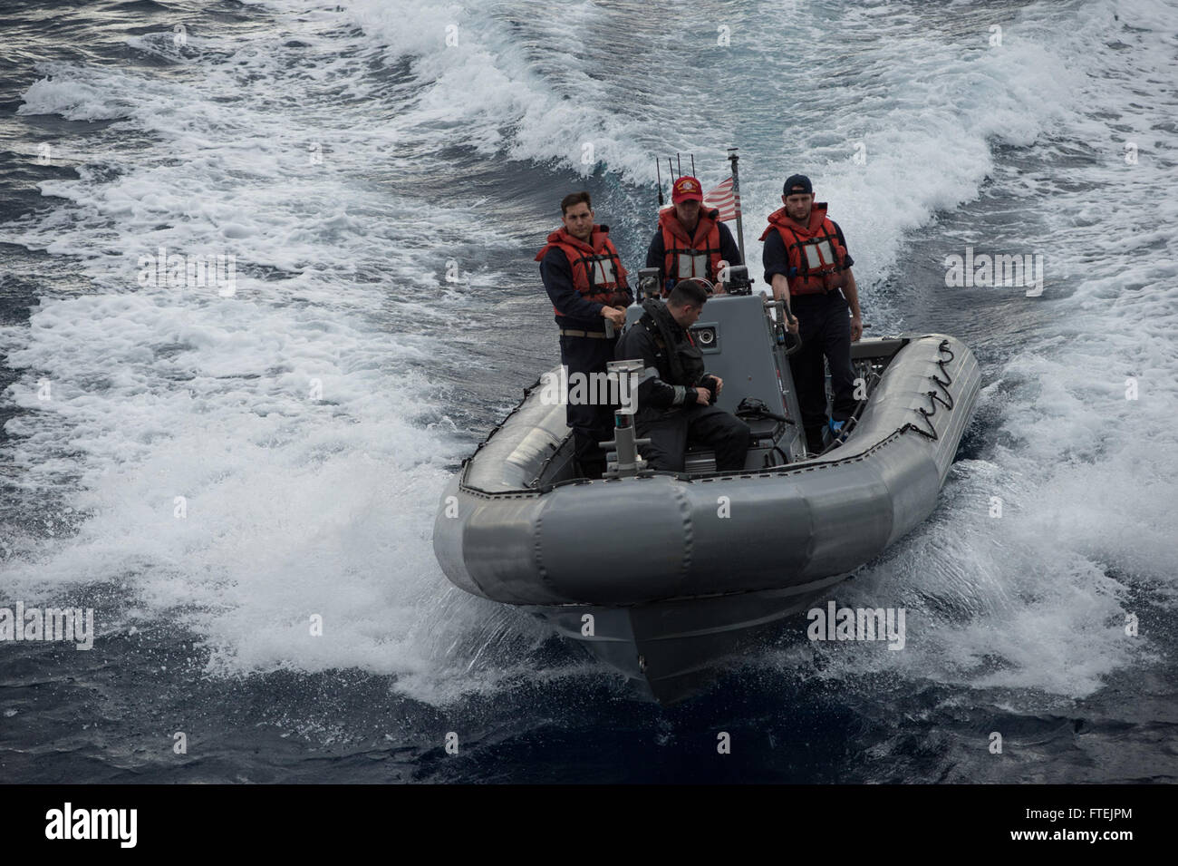 MEDITERRANEAN SEA (Dec. 24, 2014) Sailors assigned to USS Donald Cook (DDG 75) participate in small boat operations for a visit, board, search and seizure training exercise Dec. 24, 2014. Donald Cook, an Arleigh Burke-class guided-missile destroyer, forward-deployed to Rota, Spain, is conducting naval operations in the U.S. 6th Fleet area of operations in support of U.S. national security interests in Europe. Stock Photo