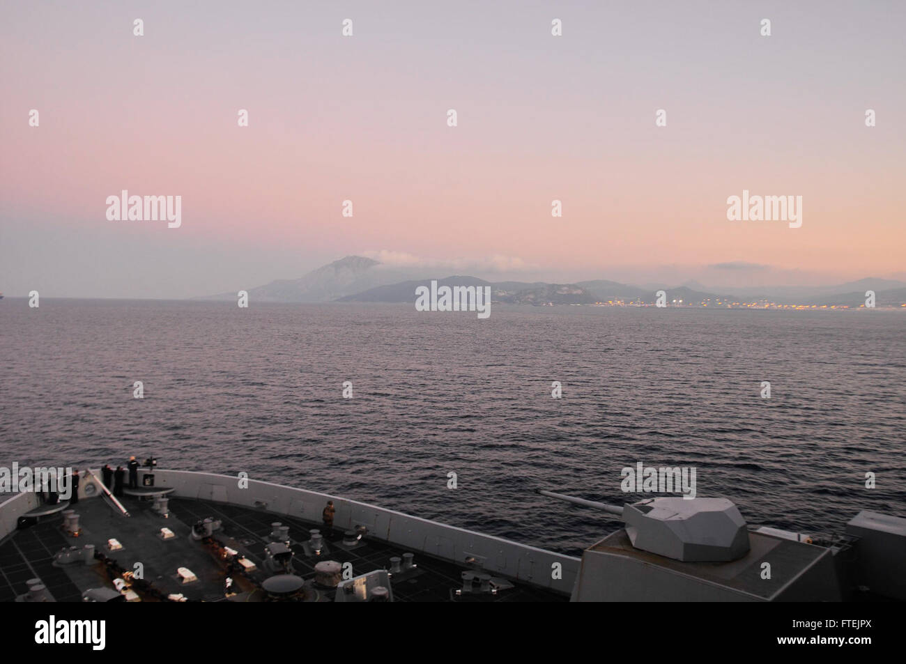 STRAIT OF GIBRALTAR (Dec. 25, 2014) The San Antonio-class amphibious transport dock ship USS New York (LPD 21) passes through the Strait of Gibraltar Dec. 25, 2014. New York, part of the Iwo Jima Amphibious Ready Group/24th Marine Expeditionary Unit, is conducting naval operations in the U.S. 6th Fleet area of operations in support of U.S. national security interests in Europe. Stock Photo