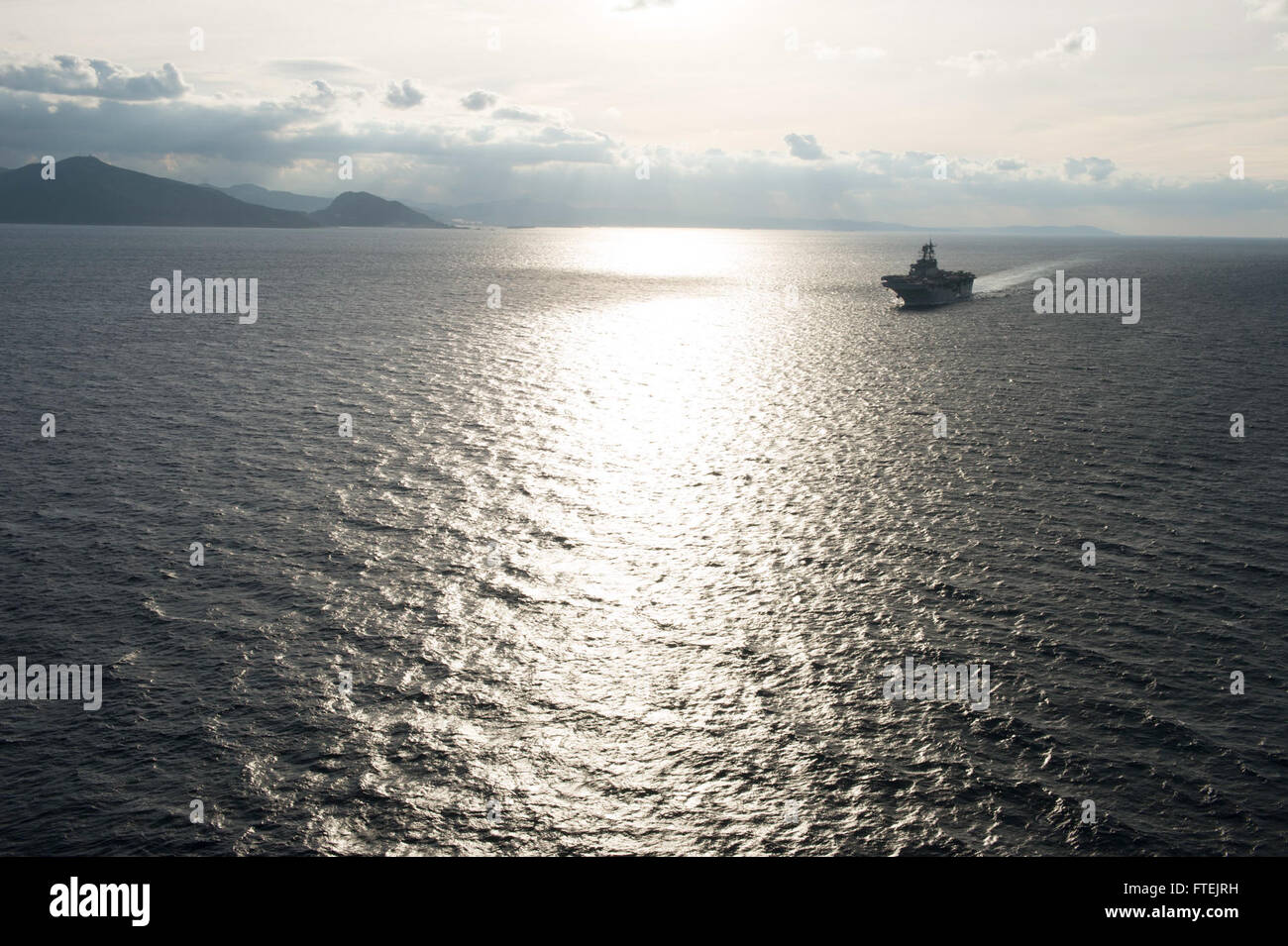 STRAIT OF GIBRALTAR (Dec. 27, 2014) Amphibious assault ship USS Iwo Jima (LHD 7) conducts an eastbound transit of the Strait of Gibraltar Dec. 27, 2014. Iwo Jima, deployed as part of the Iwo Jima Amphibious Ready Group/24th Marine Expeditionary Unit (IWO ARG/24 MEU), is conducting naval operations in the U.S. 6th Fleet area of operations in support of U.S. national security interests in Europe. Stock Photo