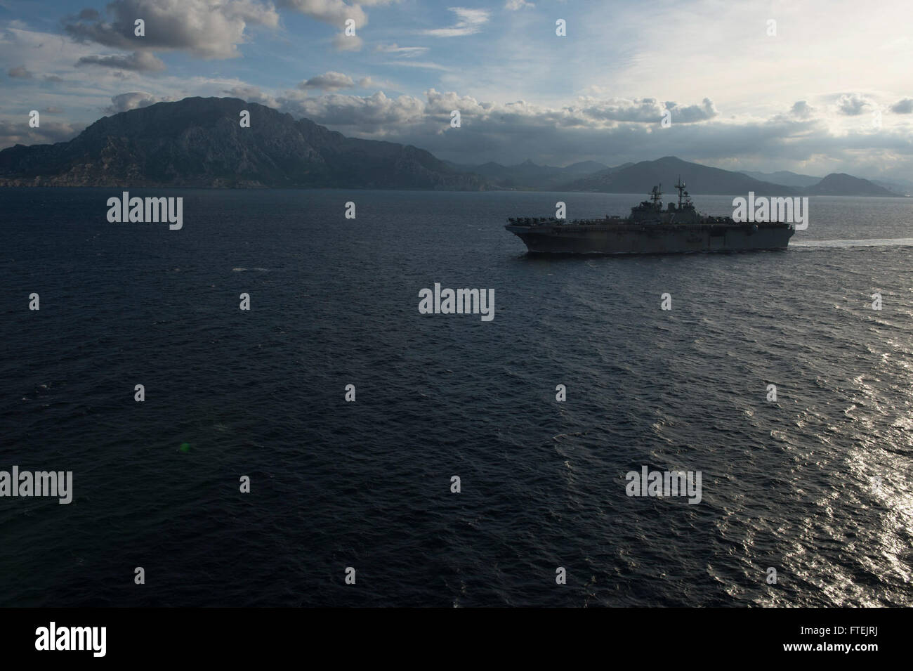 STRAIT OF GIBRALTAR (Dec. 27, 2014) Amphibious assault ship USS Iwo Jima (LHD 7) conducts an eastbound transit of the Strait of Gibraltar Dec. 27, 2014. Iwo Jima, deployed as part of the Iwo Jima Amphibious Ready Group/24th Marine Expeditionary Unit (IWO ARG/24 MEU), is conducting naval operations in the U.S. 6th Fleet area of operations in support of U.S. national security interests in Europe. F. Stock Photo