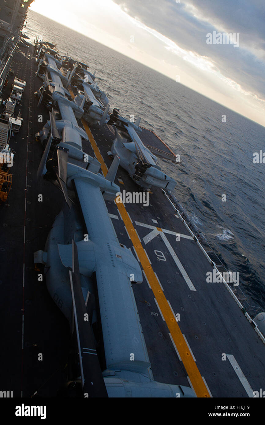 MEDITERRANEAN SEA (Dec. 28, 2014) MV-22 Ospreys from Marine Medium Tiltrotor Squadron 365 (Reinforced), 24th Marine Expeditionary Unit (MEU), are in the full-stow position aboard the flight deck of USS Iwo Jima (LHD 7) in preparation for rough weather Dec. 28, 2014. The 24th MEU and Iwo Jima Amphibious Ready Group are conducting naval operations in the U.S. 6th Fleet area of operations in support of U.S. national security interests in Europe. Stock Photo